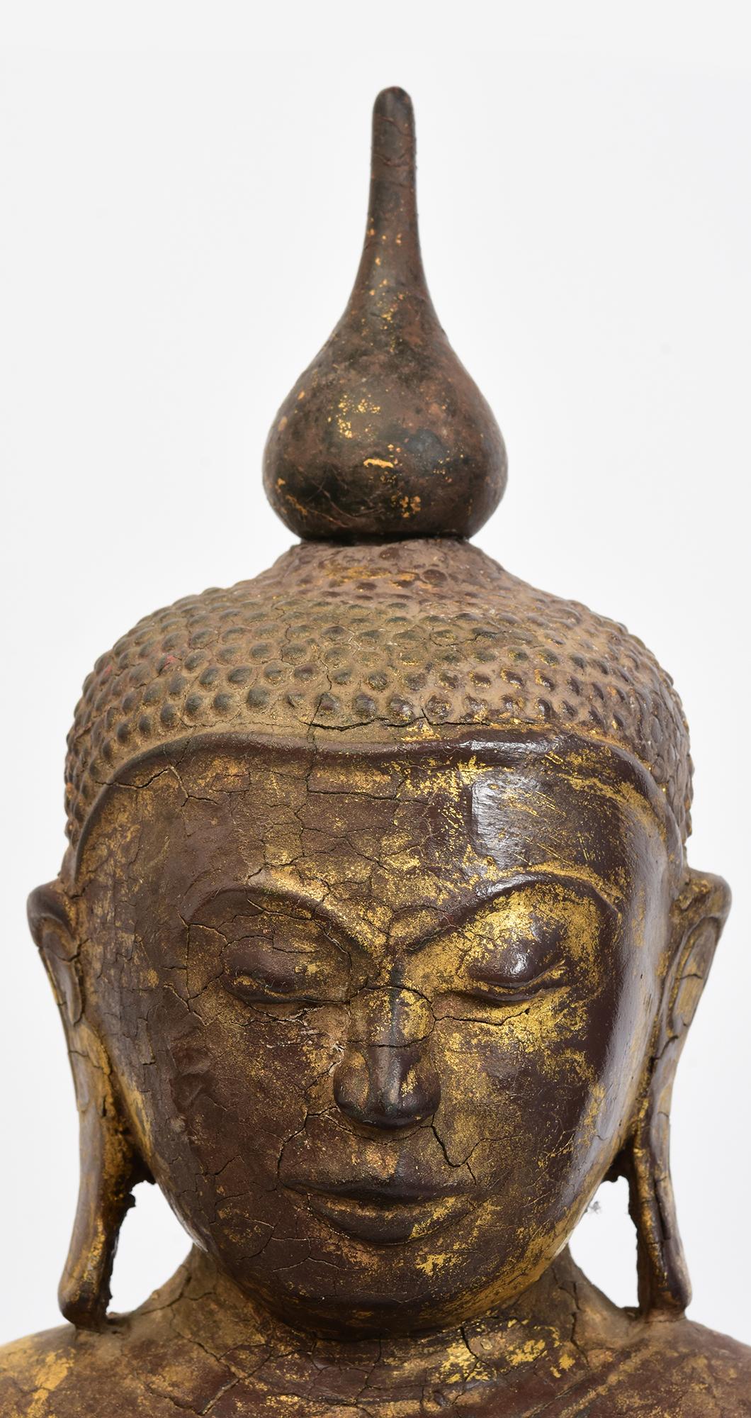 Bouddha ancien en bois de Birmanie assis en posture Mara Vijaya (appelant la terre à témoigner) sur une base.

Age : Birmanie, Période Shan, 18ème siècle
Dimensions : Hauteur 55.7 C.M. / Largeur 25 C.M. / Profondeur 12.8 C.M.
Condit : Bon état