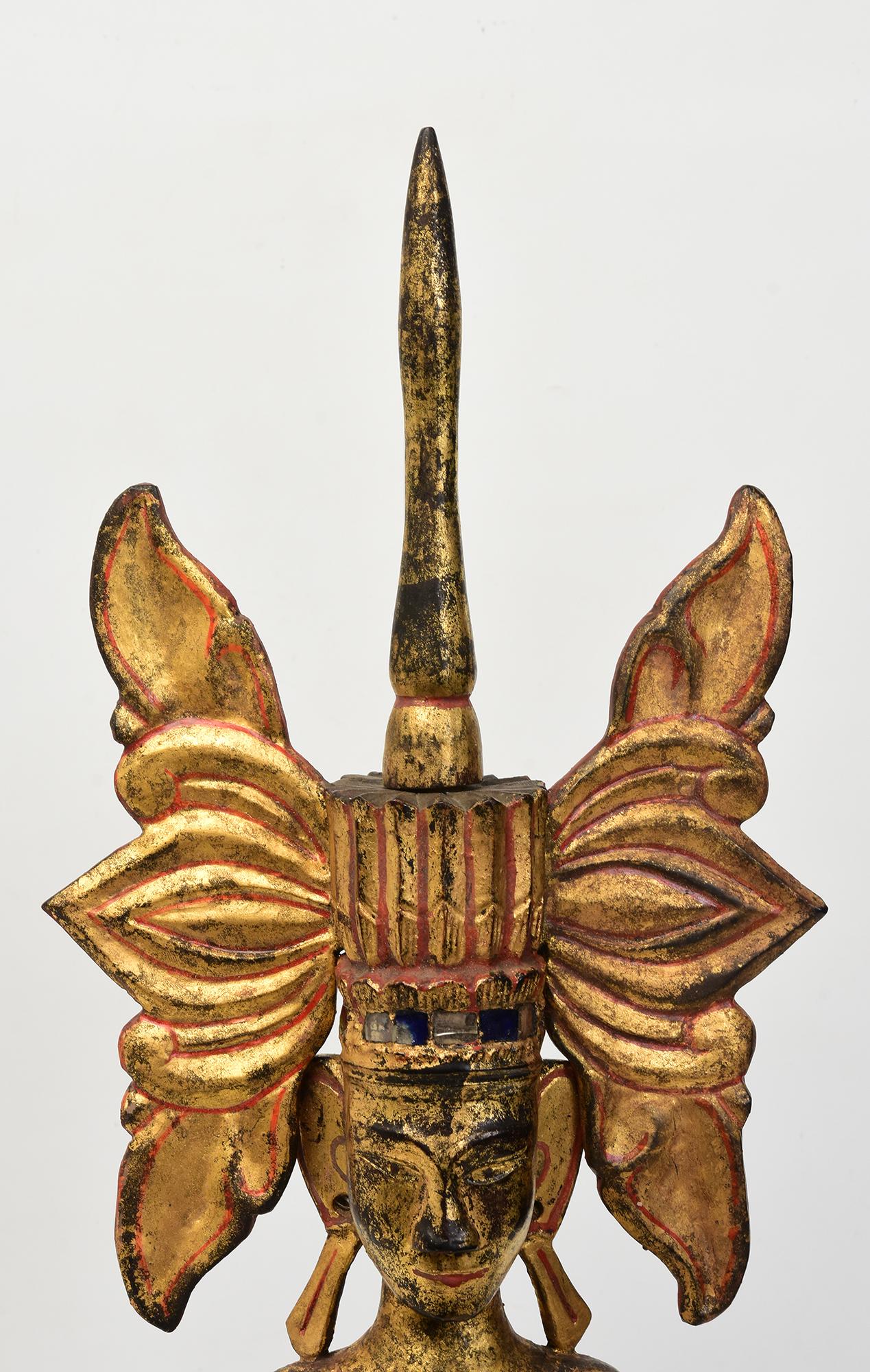 Antique Burmese wooden seated crowned Buddha or sometimes known as 'King Buddha's, wearing diadem-crowns and ornaments of kings instead of ordinary monk's robes. 
Crowned Buddha represents the Buddha's role as a universal sovereign. 

Age: Burma,