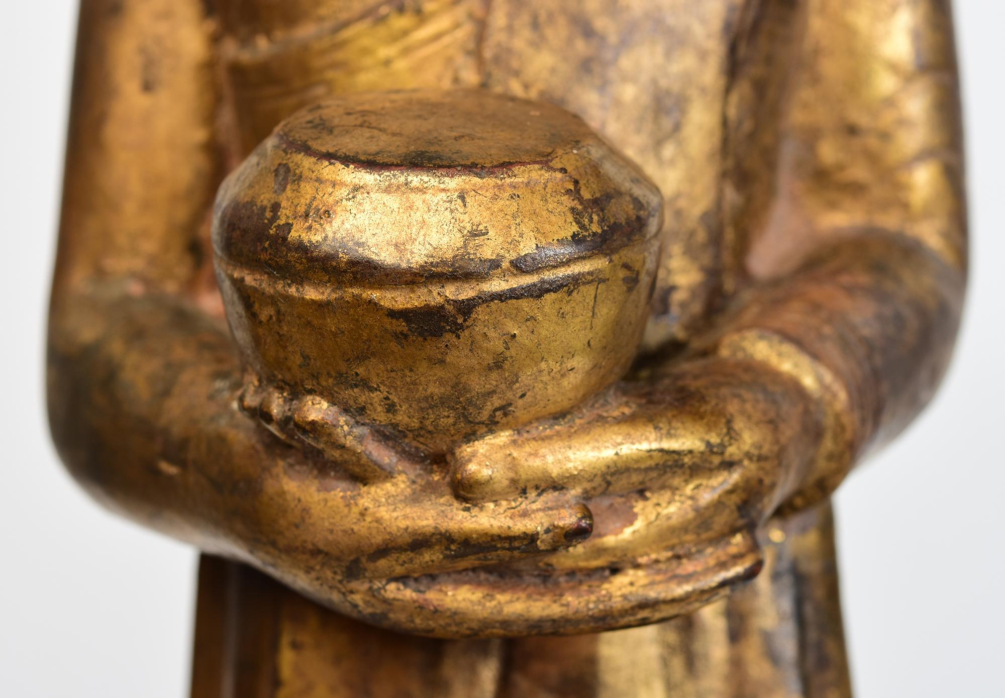 Hand-Carved 18th Century, Shan, Antique Burmese Wooden Standing Disciple / Monk Holding Bowl For Sale