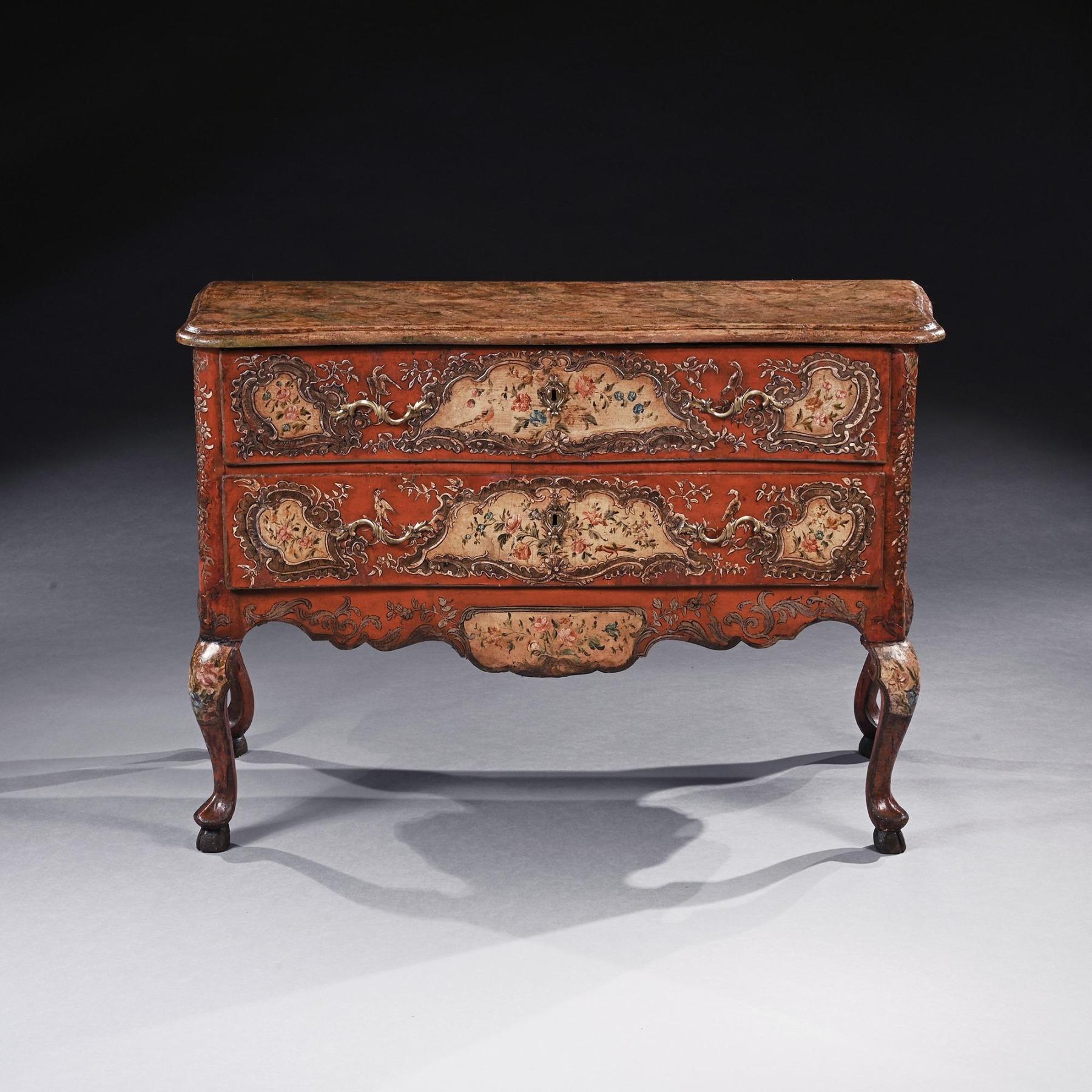 A very rare 18th century Sicilian Rococo Polychrome Painted and Parcel Gilt Serpentine Commode.

Italy Sicily circa 1750-70 

Of wonderful colour having a serpentine moulded simulated marble top above two long drawers decorated with flower and