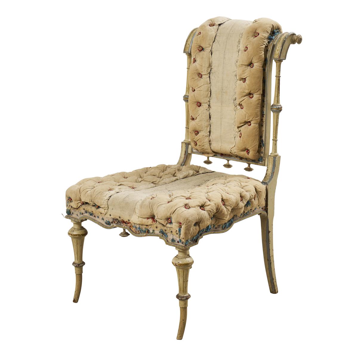 A rare treasure discovered in France, this courtly 18th-century slipper chair, with its fanciful carved frame and button-tufted upholstery, is not only a gorgeous antique but also a fabulous conversation piece.