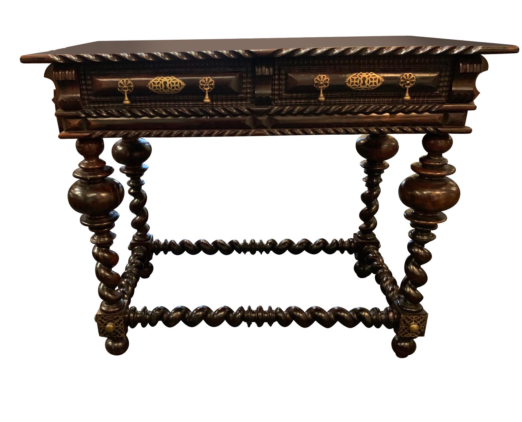 18th century Portuguese side table with two drawers.
Classic decorative trim with ornate brass details.
Barley twist legs and stretcher.
Palissandre wood.
Smaller version also available F2957.