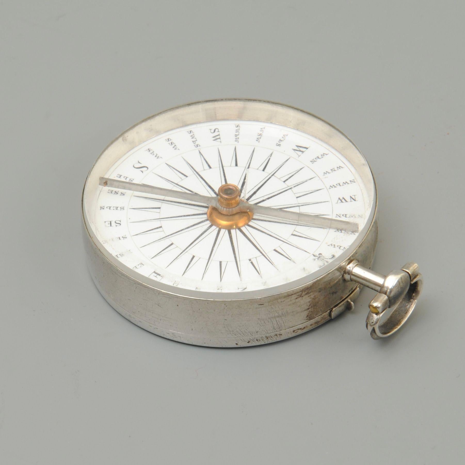 An 18th century silver pocket compass signed by Watkins Charing cross, London
The enamel compass rose finely segmented 
Marked TH and dated 1787.