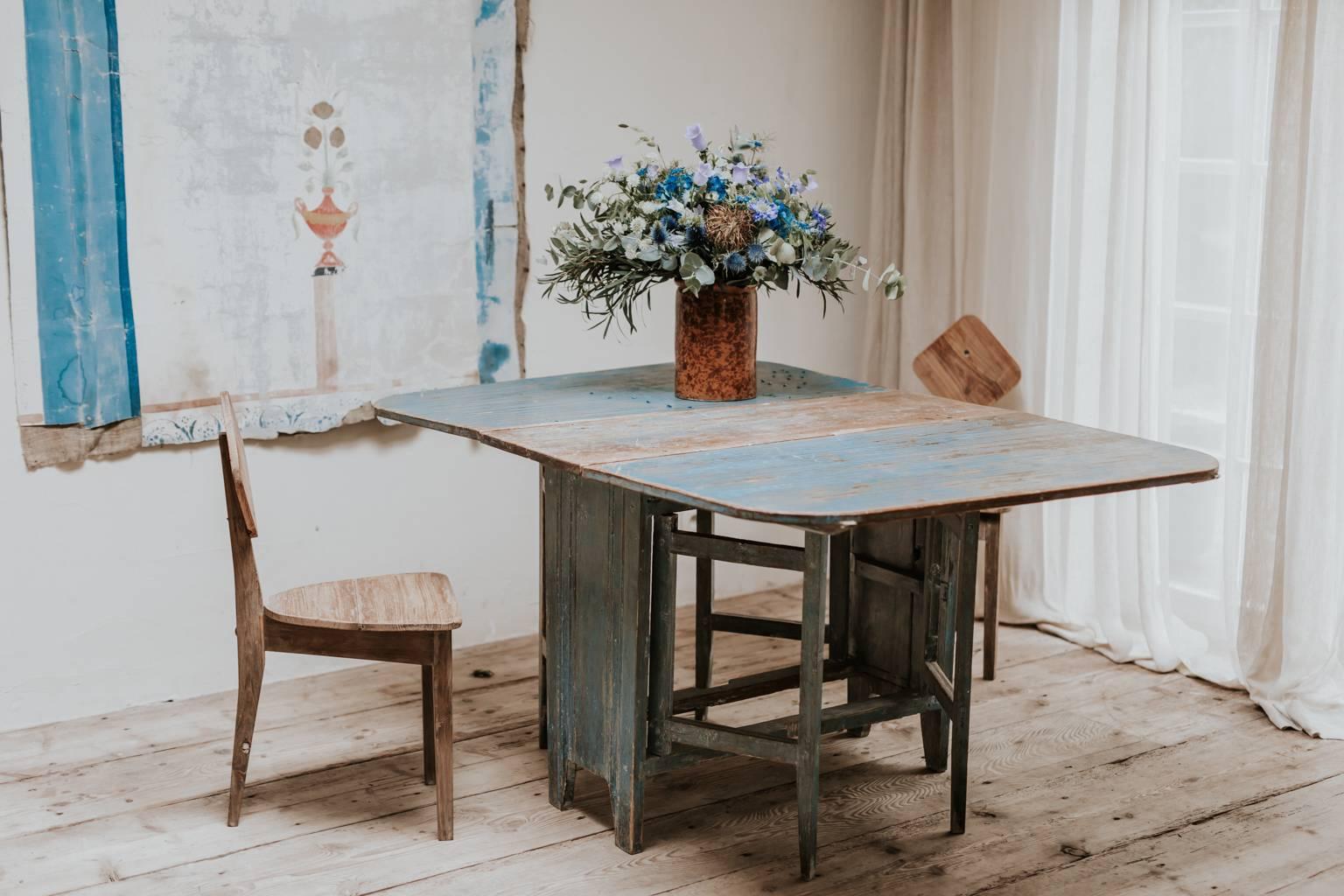 This is a Swedish slagbord table, original blue paint.