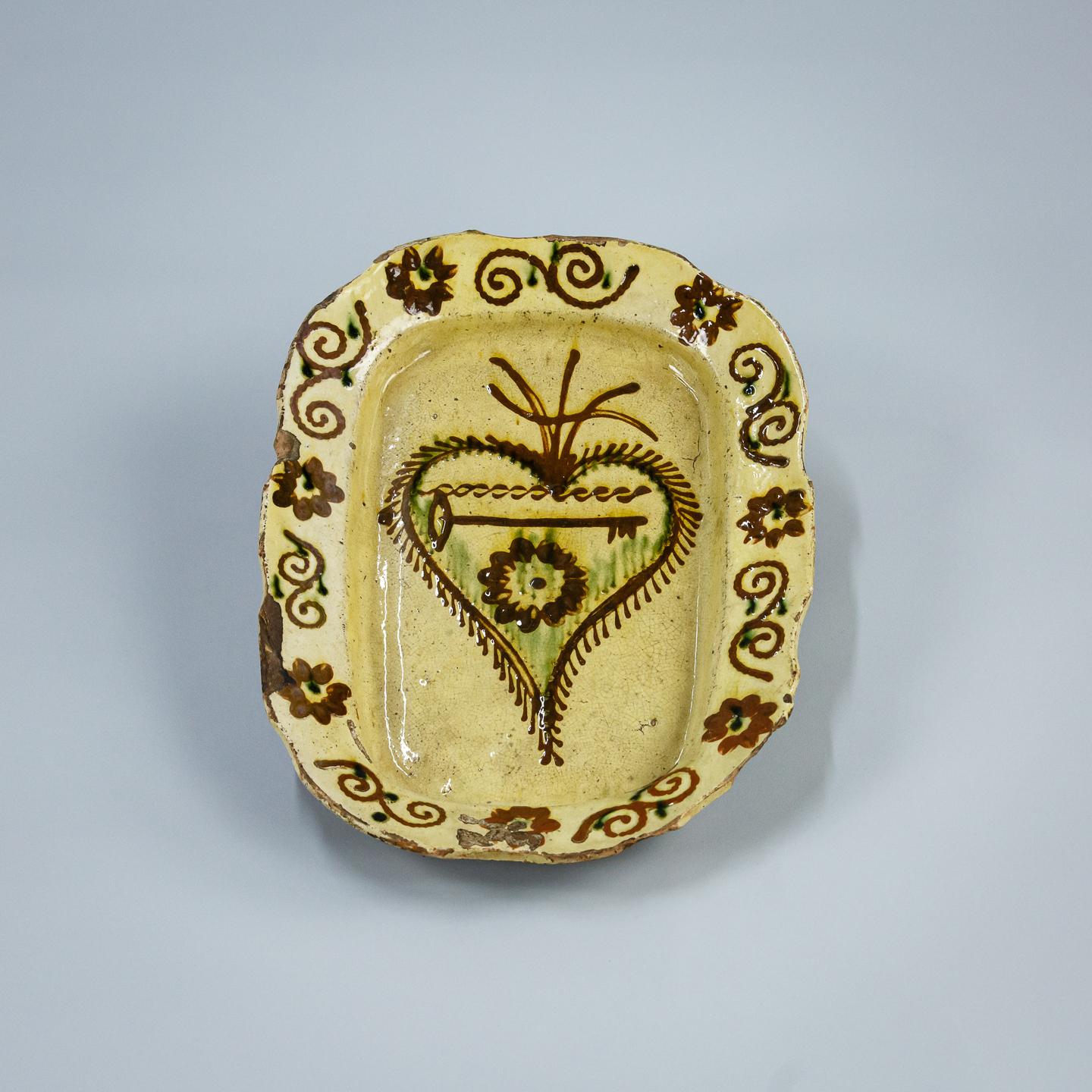 Slipware marriage plate. decorated with the key to unlock the heart of love. France Circa 1780. 
Probably unique, made specifically for the happy couple as a memory of their wedding day.
Good condition, with some light losses to the glaze. Some