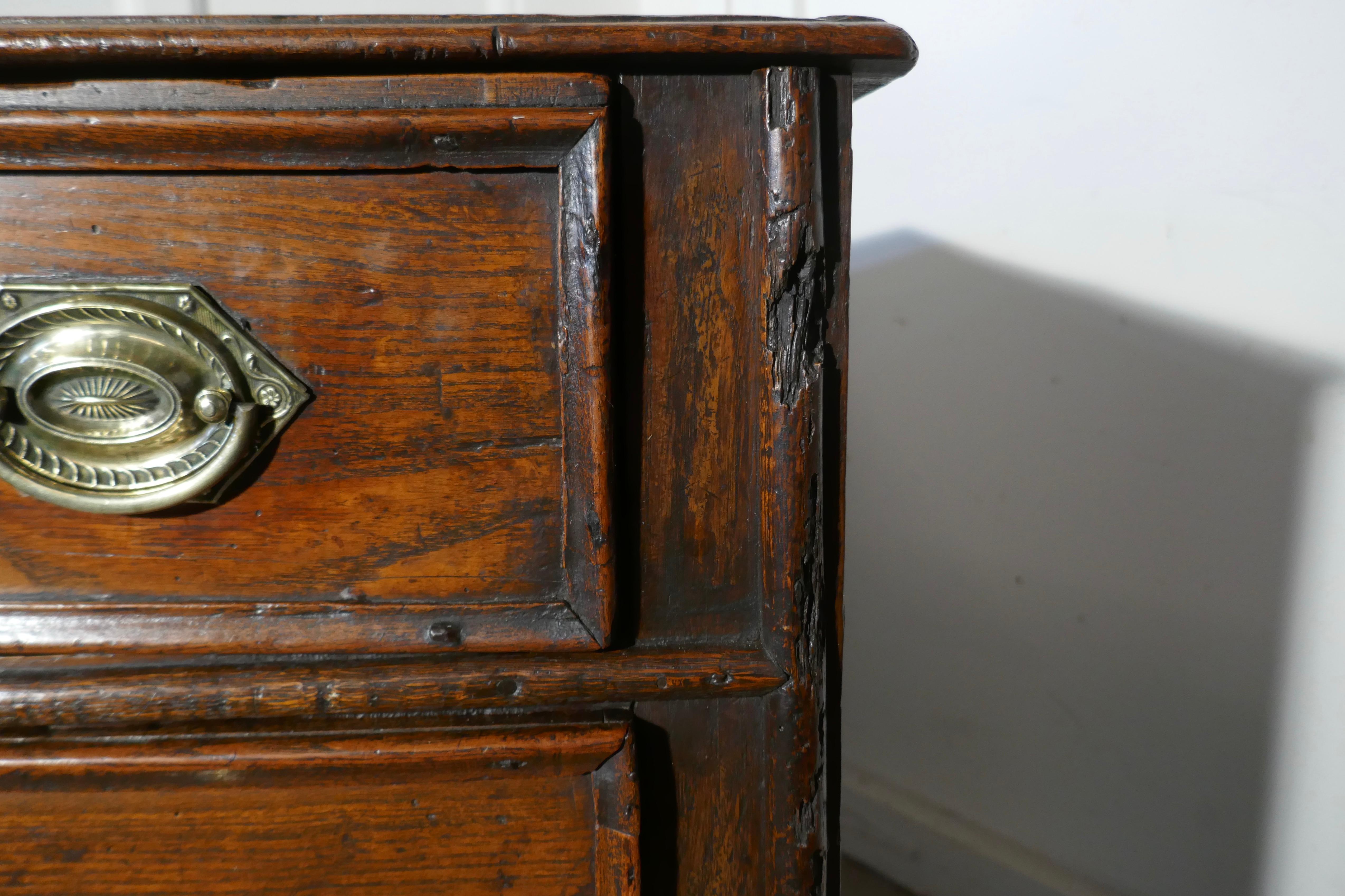 18th century small elm country chest of drawers

This is a lovely piece dating from circa 1750, it is a small beautifully proportioned chest with 3 long drawers. The sides of the chest are paneled, the top is thin and made from 2 pieces of