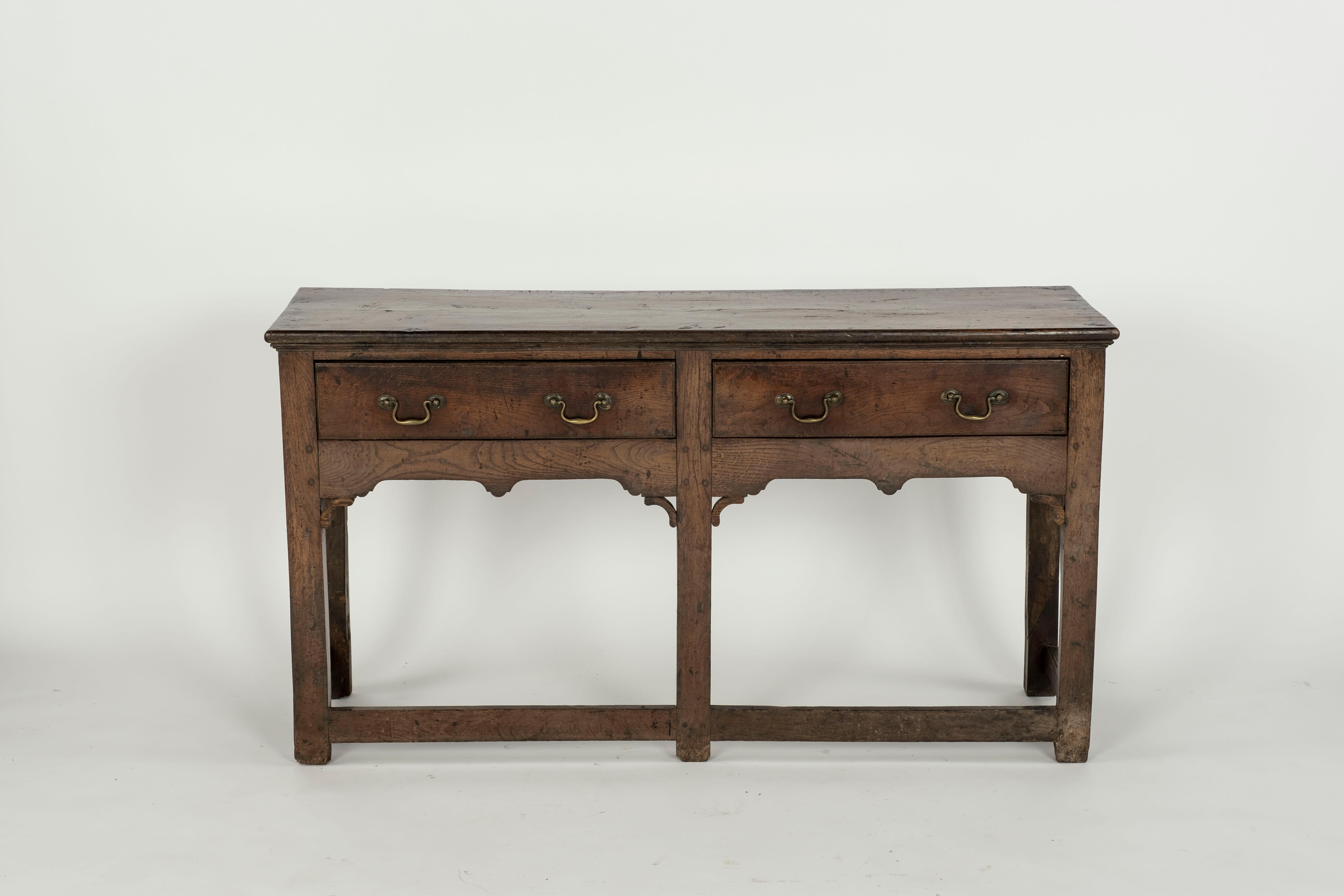 18th Century oak dresser base with detail in inside front corners. Straight legs.