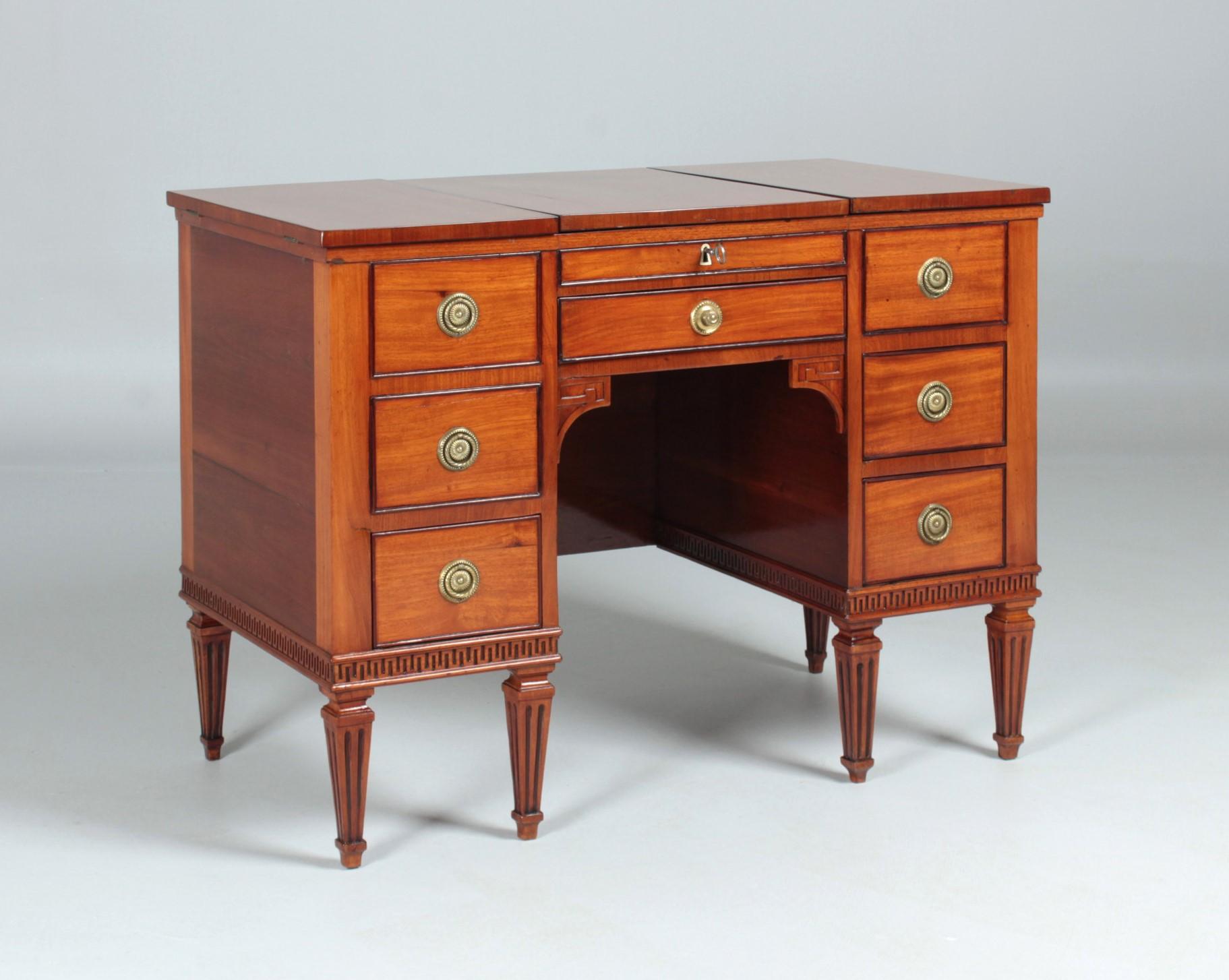 Small make-up and writing desk

South Germany
Louis XVI circa 1780

Dimensions: H x W x D: 74 x 96 x 52 cm

Description:
Antique multifunctional piece of furniture from the late 18th century.

Desk standing on fluted and downwardly tapering pointed