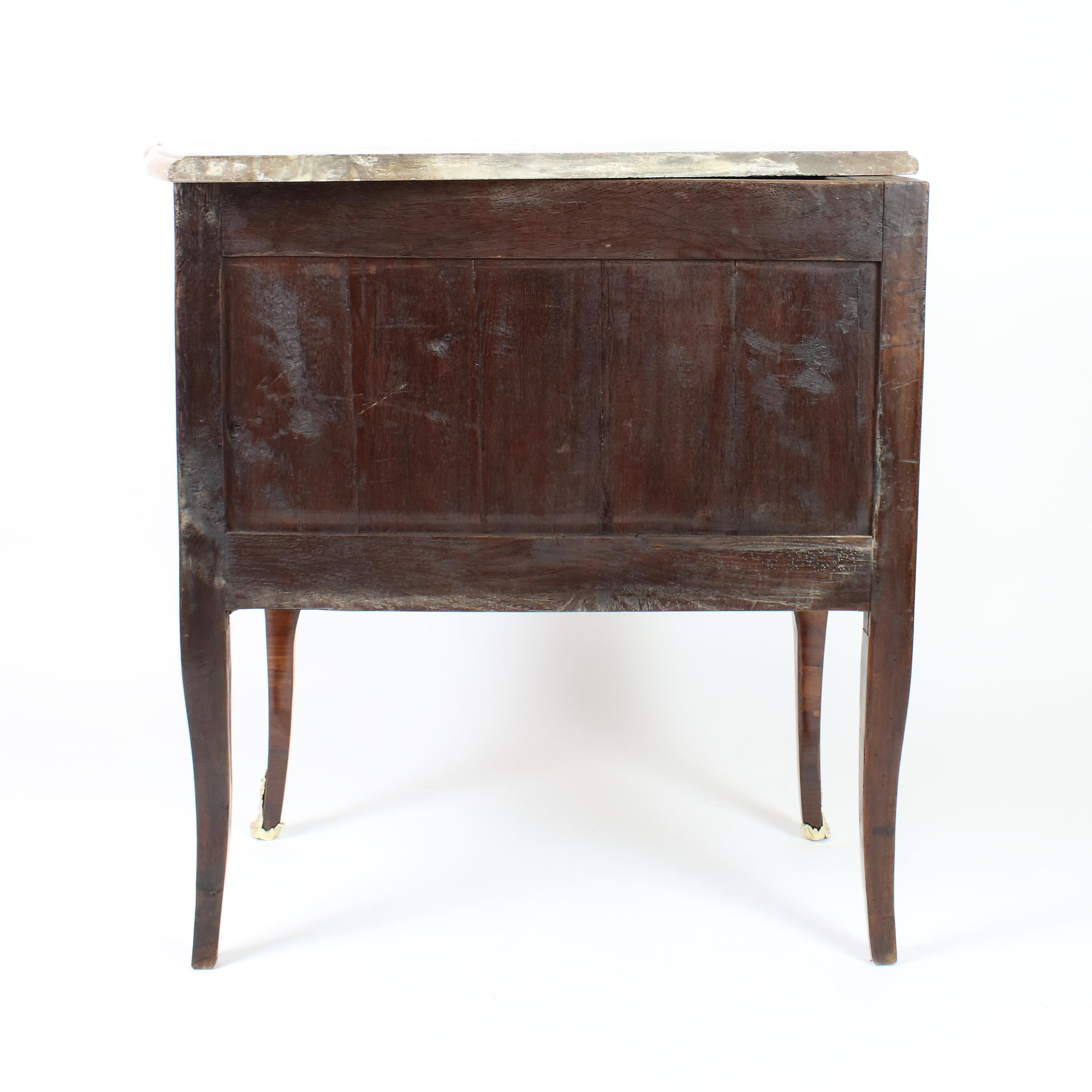 18th century Louis XV small Marquetry bombé shaped commode or sauteuse in the manner of Pierre Roussel (1723-1782):

A Louis XV gilt bronze mounted marquetry commode with bombé front and sides and shaped apron standing on four cabriole legs,