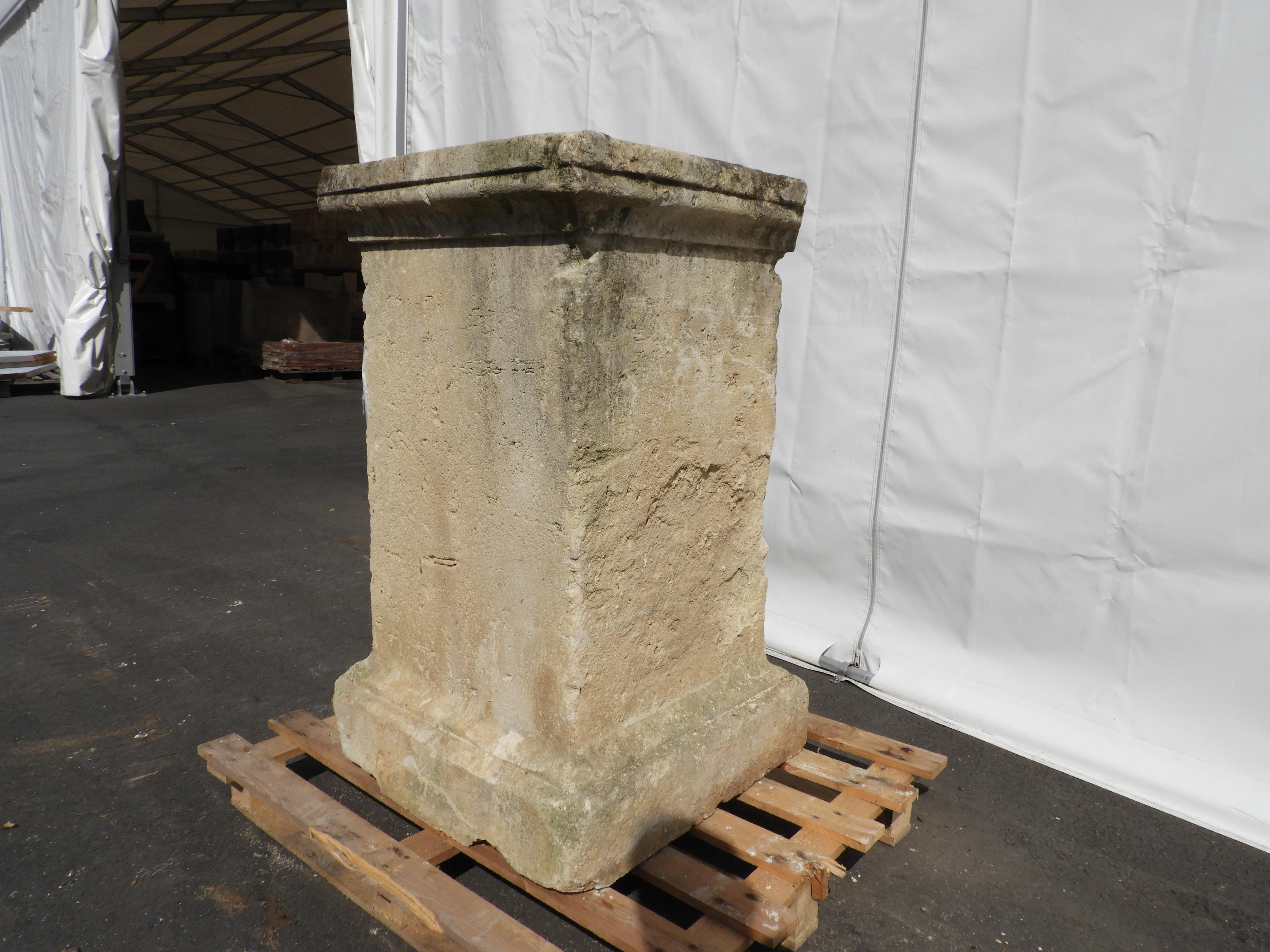 18the century French limestone pedestal with a warn rustic look.