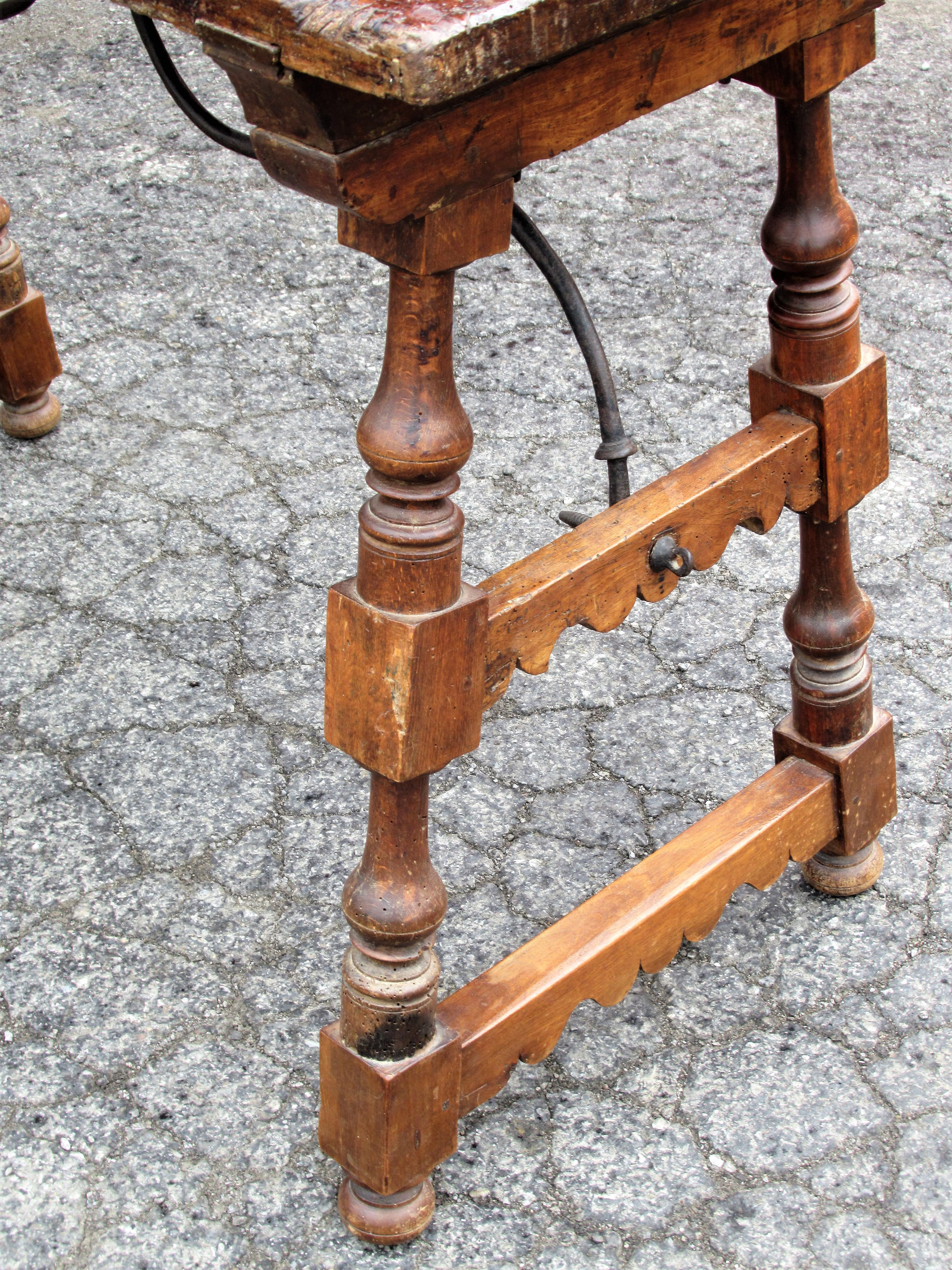 Antique Spanish Baroque walnut console server table. The table having early pegged construction, hand forged iron stretcher and nice old color. Dates from 17th century - 18th century. Look at all pictures and read condition report in comment section.