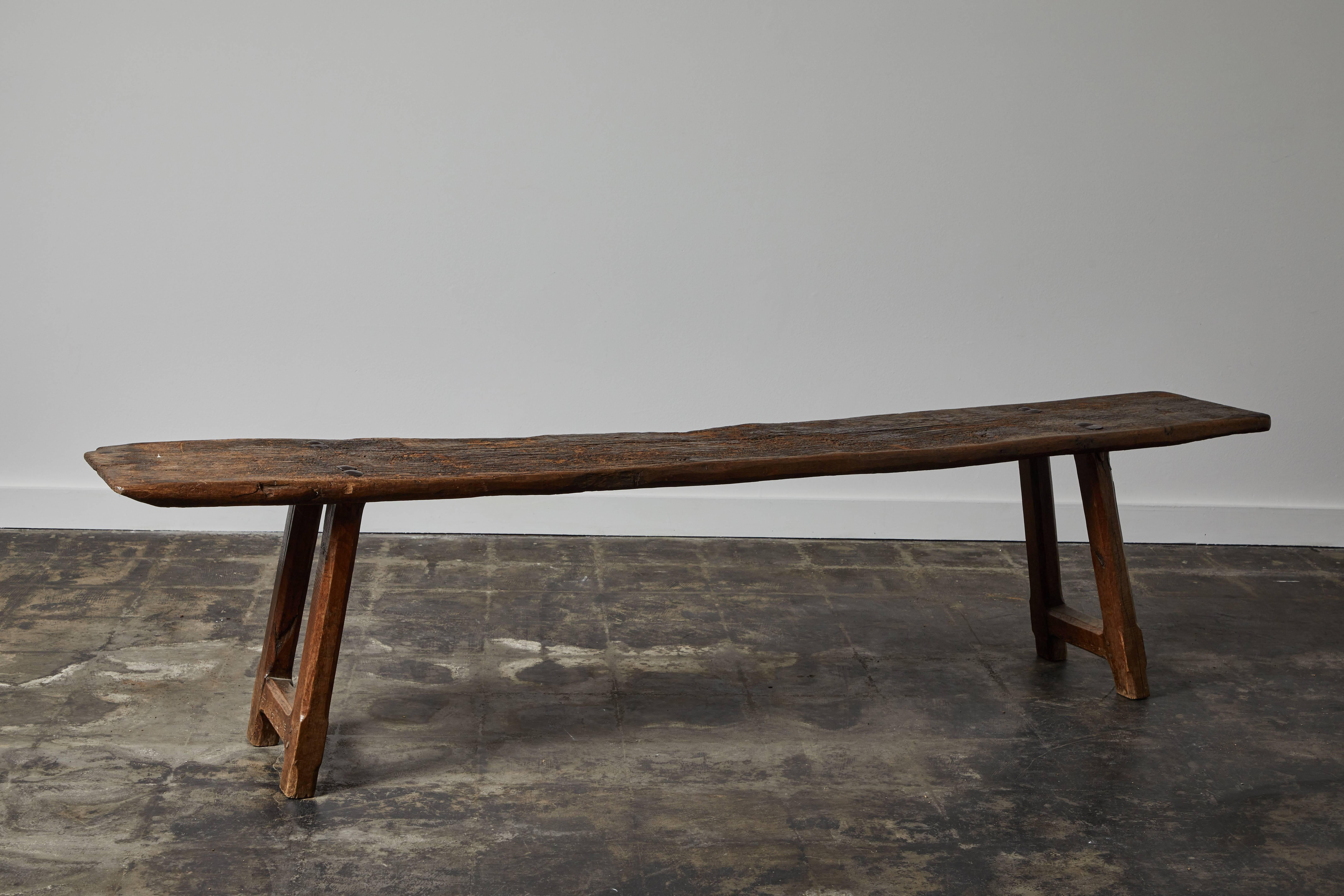 Handmade 18th century wood bench with strong patina and wrought iron details. Made in Spain, circa 1700s.