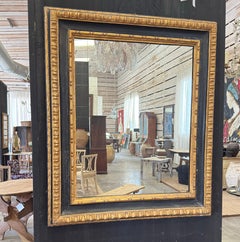 Specchio spagnolo del XVIII secolo con finiture in nero e foglia d'oro
