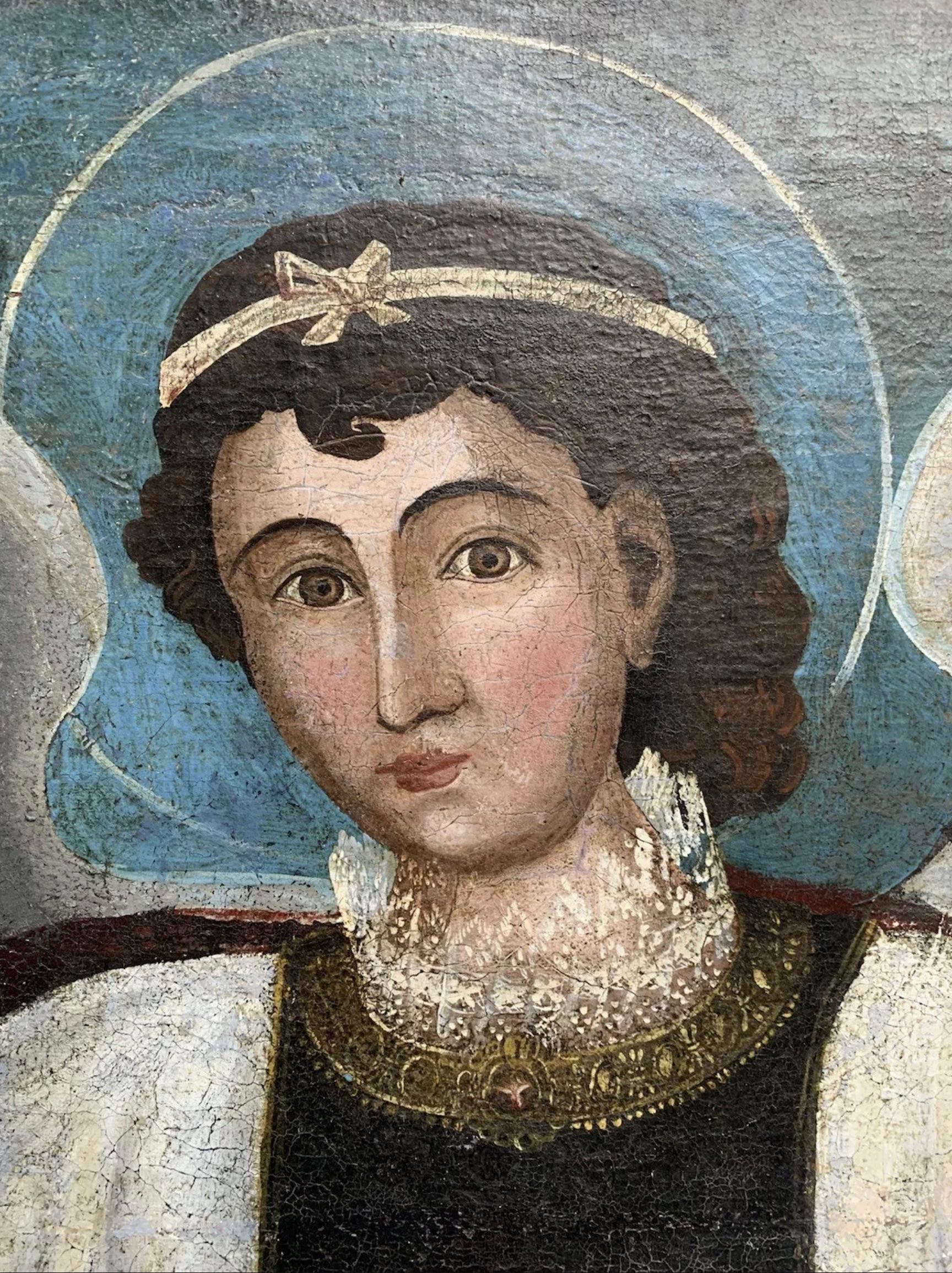 A monumental and captivating 18th-century Spanish Colonial oil on canvas depicting Saint Raphael the Archangel, rendered in grand scale with overall dimensions of 167 cm height by 116 cm width, including the frame. Likely originating from the Andean