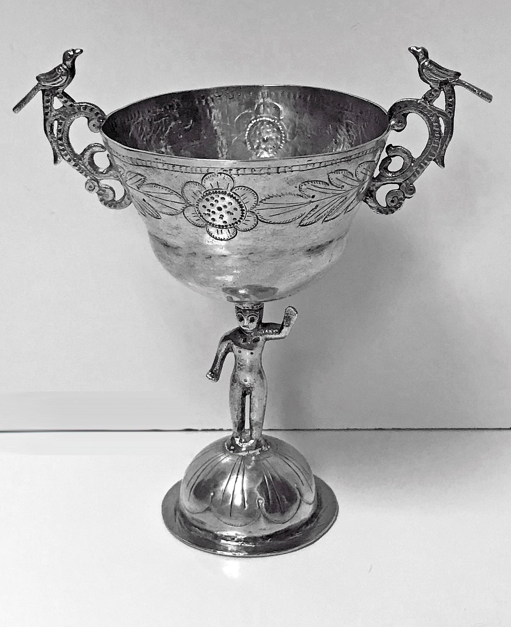 18th century Spanish colonial silver chalice cup. The cup on dome base supported on a figural column stem and cup with engraved flower and leaf pattern surround, the handles in the shape of birds surmounted on foliage either side of cup. Peru or