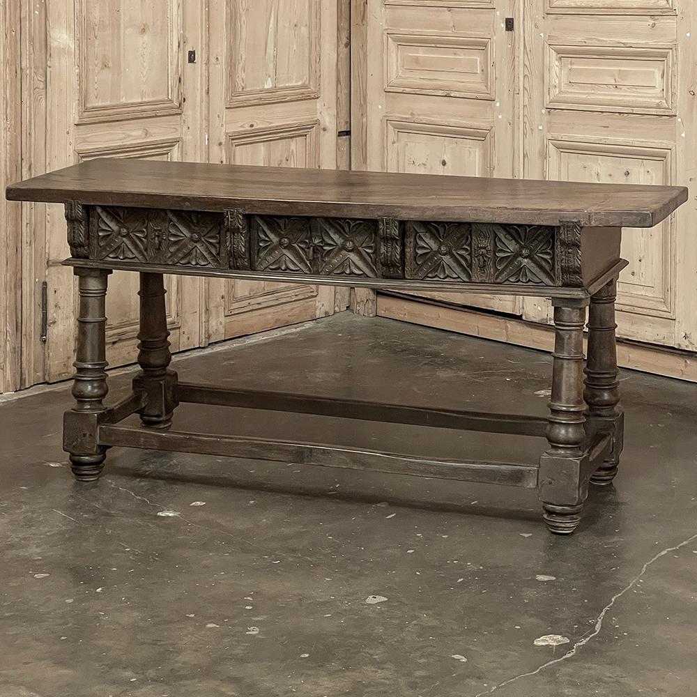 18th Century Spanish Colonial Walnut Console ~ Sofa Table is a splendid reminder of a bygone era!  Hand-crafted from old growth walnut, it features a single thick plank of solid walnut serving as the top surface.  A casework that contains three