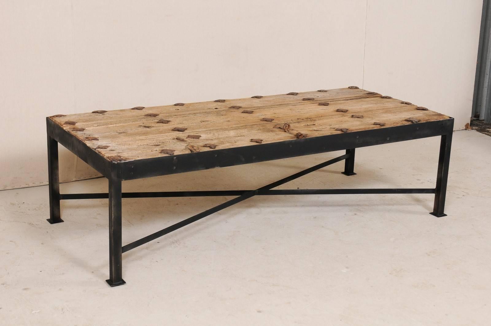 Rustic 18th Century Spanish Door Coffee Table with Patinated Iron Quatrefoil Grommets