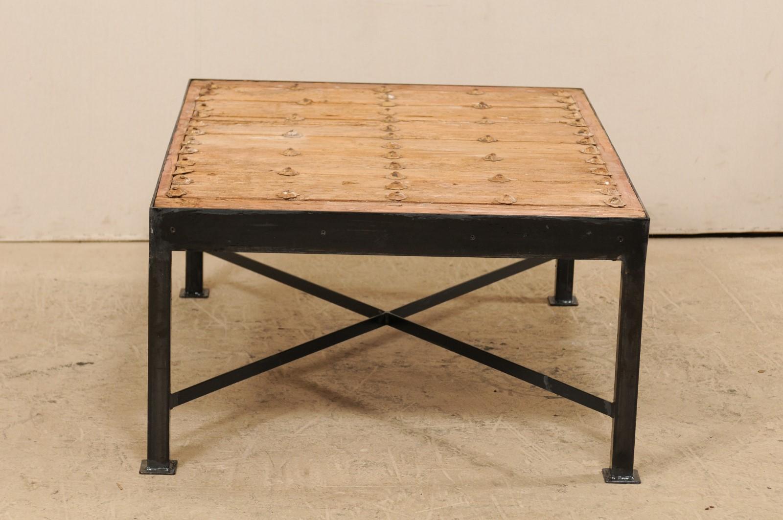 A Fantastic Custom Coffee Table w/ 18th C. Spanish Door Top on Black Metal Base In Good Condition For Sale In Atlanta, GA