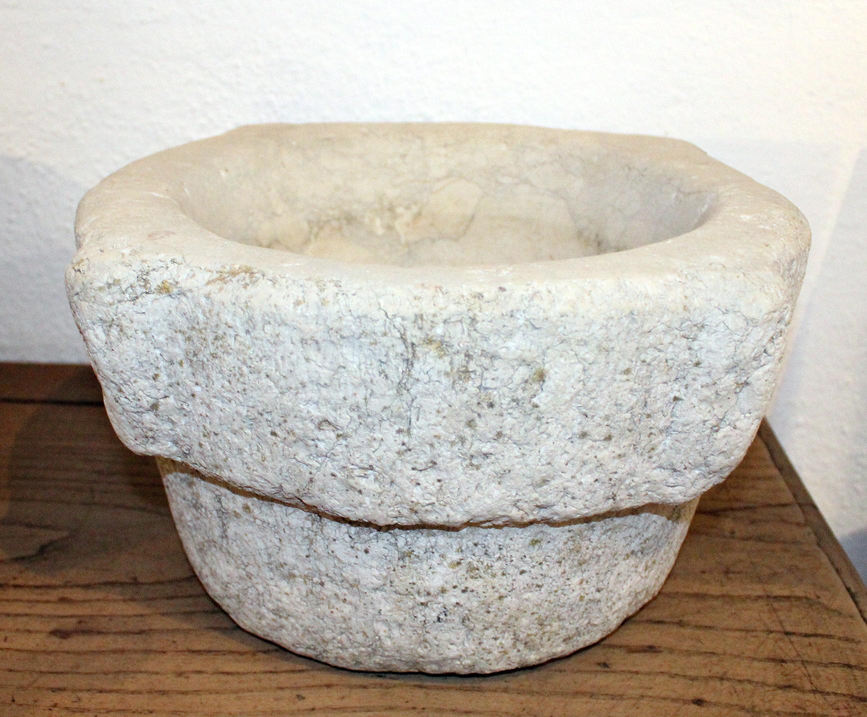 18th century Spanish hand carved stone kitchen mortar, used in kitchens and pharmacies to prepare herbs for cooking or healing.
 