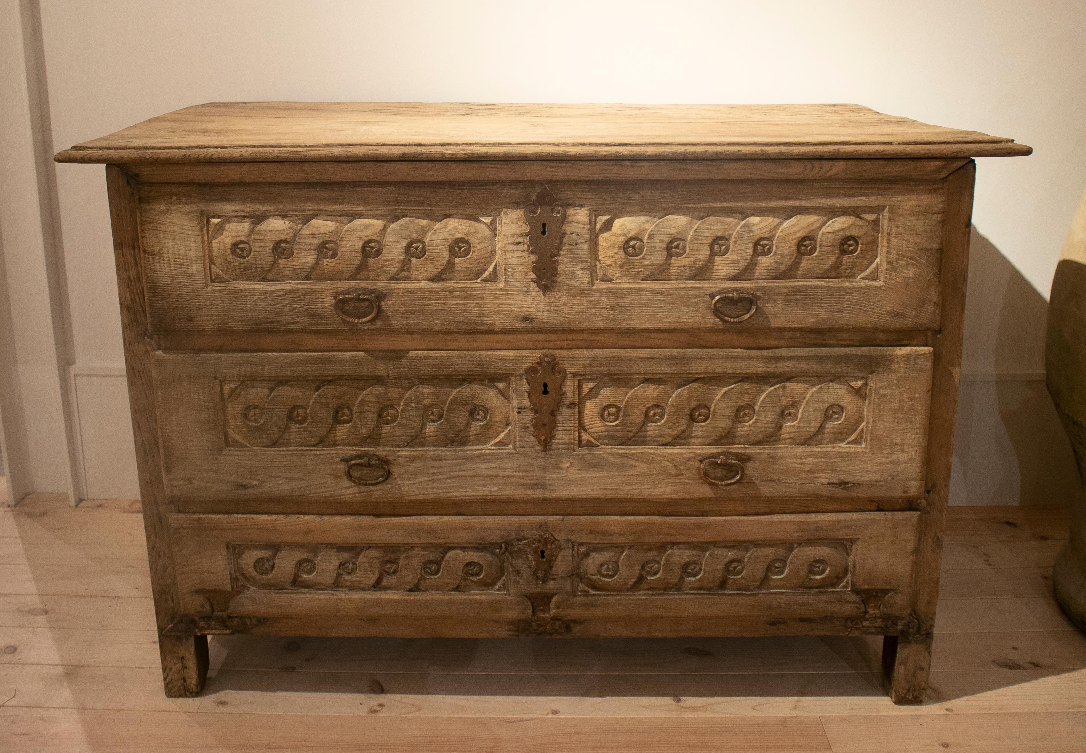 18th century Spanish hand carved three drawer washed wood cabinet.