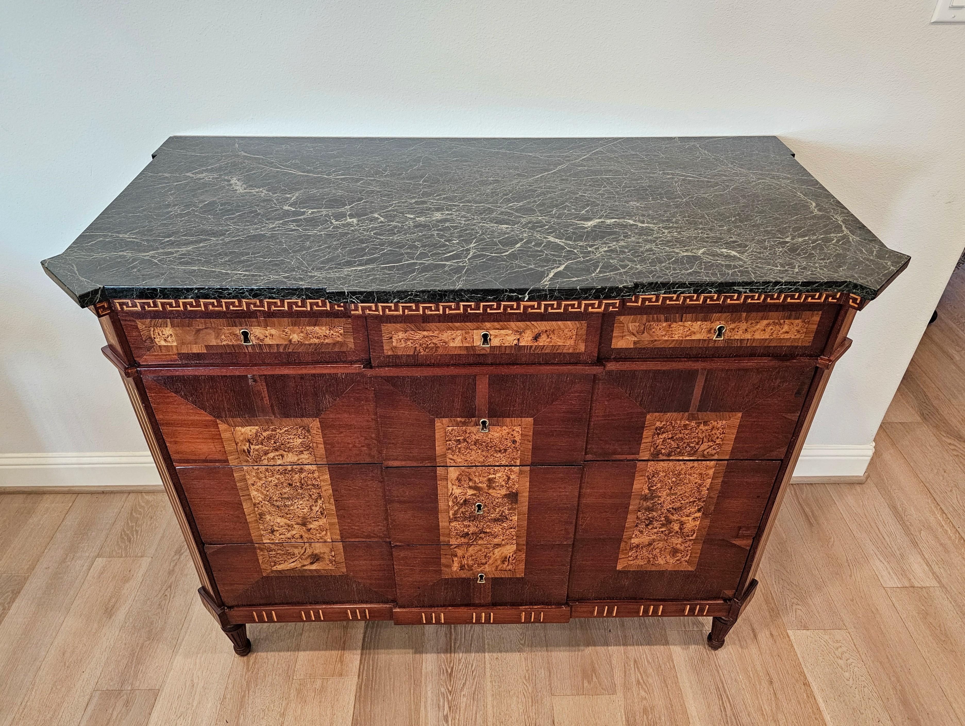 A rare and most impressive antique Spanish Neo-classical marble-topped breakfront chest of drawers commode. 

Hand-crafted in Spain in the 18th century, King Charles III Period (1759-1788) of the Spanish Empire Bourbon Dynasty, a dynasty with deep
