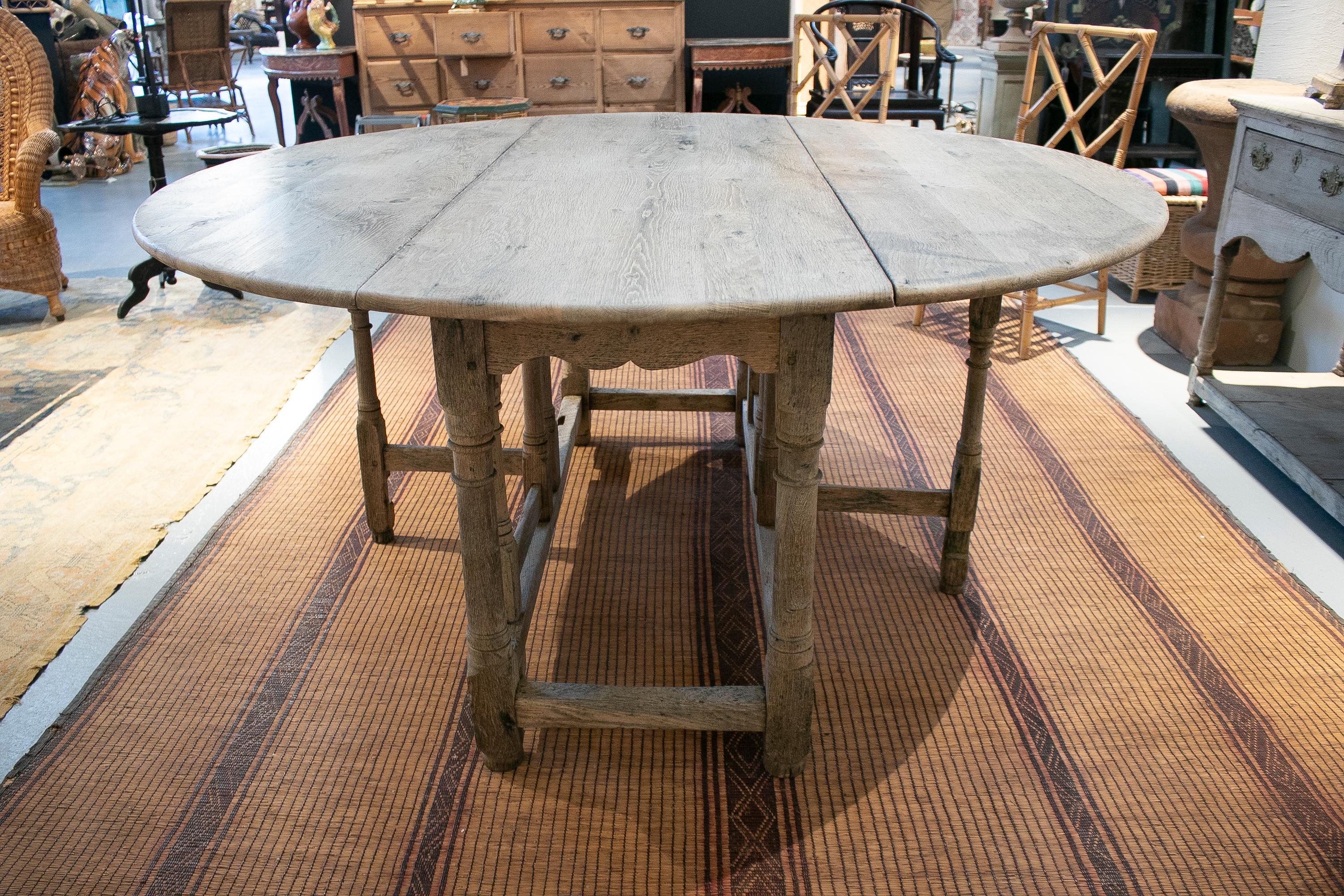 18th century Spanish oak round folding table.