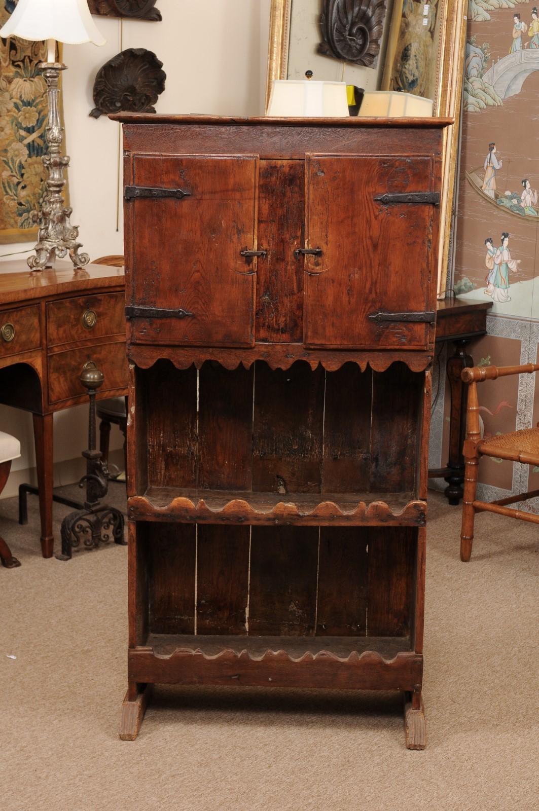 18th century Spanish pine cupboard with 2 cabinet doors over open shelves.
   