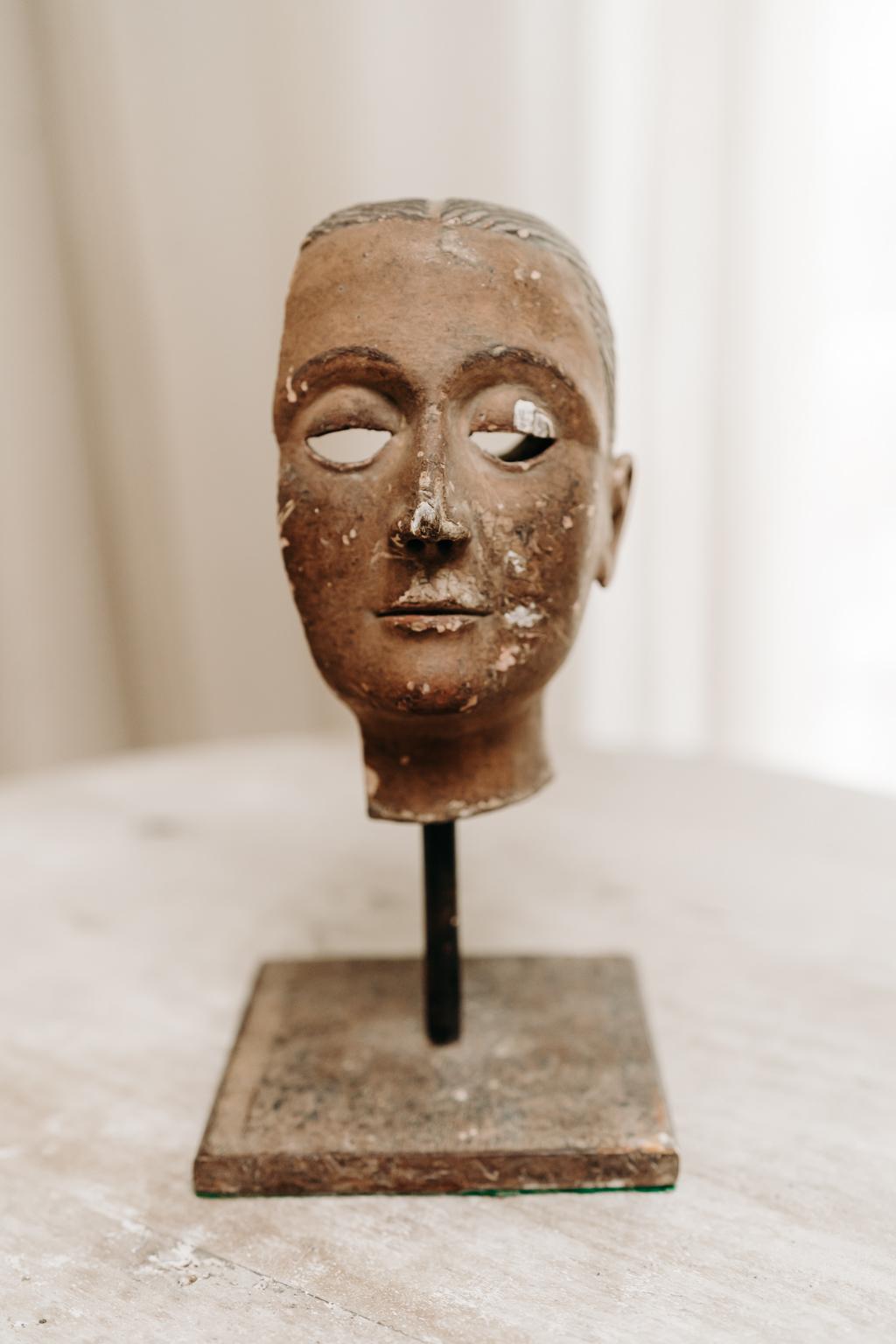 a polychromed wooden Santos head, found in Spain, mid 18th century,
height is 16 cm with foot 24 cm, width 9 cm with foot 12 cm, depth 7 cm with foot 12 cm. 