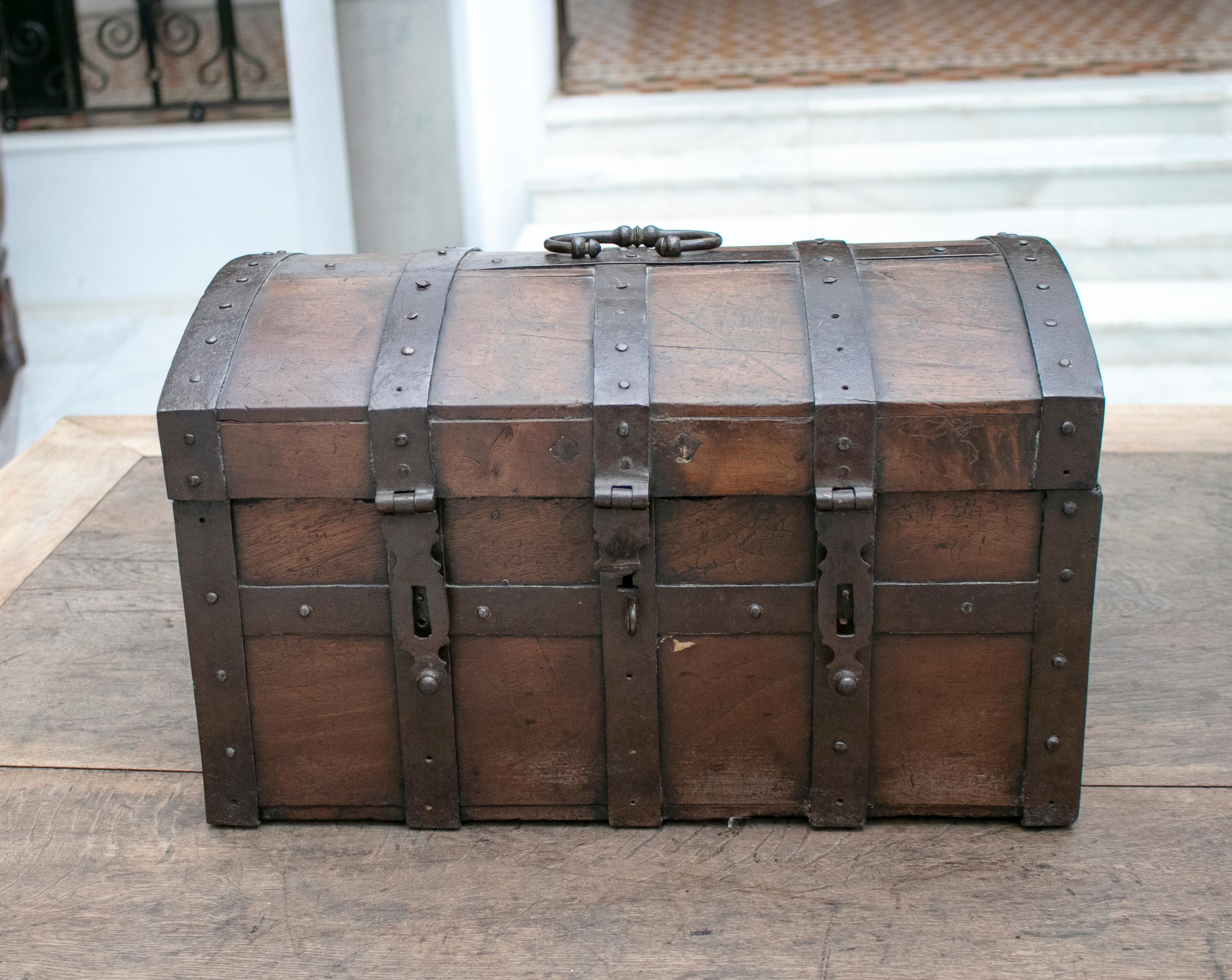 18th century Spanish walnut chest with wrought iron fittings and reinforcement.