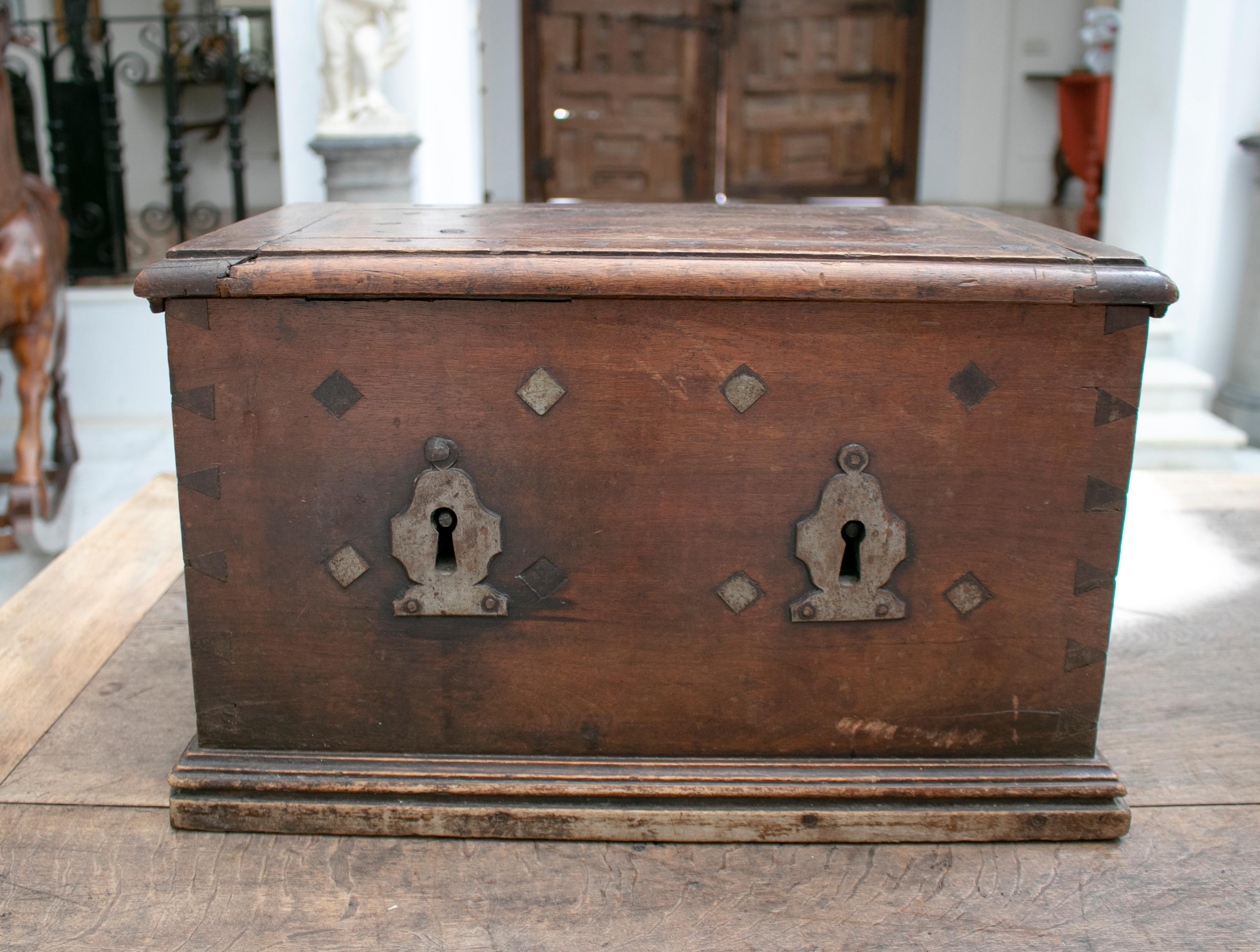 18th century Spanish walnut strongbox safe with two locks for added security and original wrought Iron fittings.

 