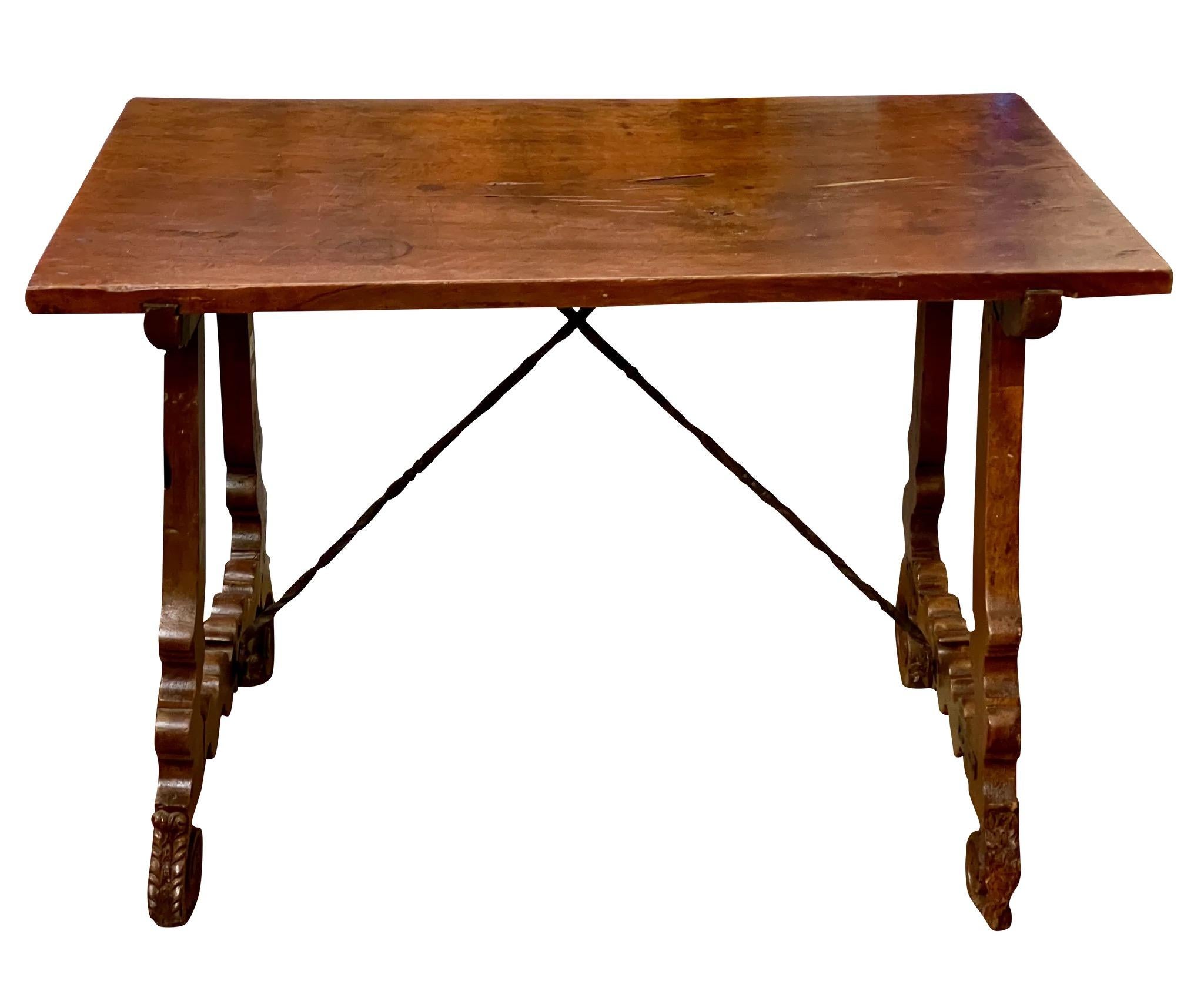 Spanish walnut tavern table, 18th c., with wrought iron cross stretchers
