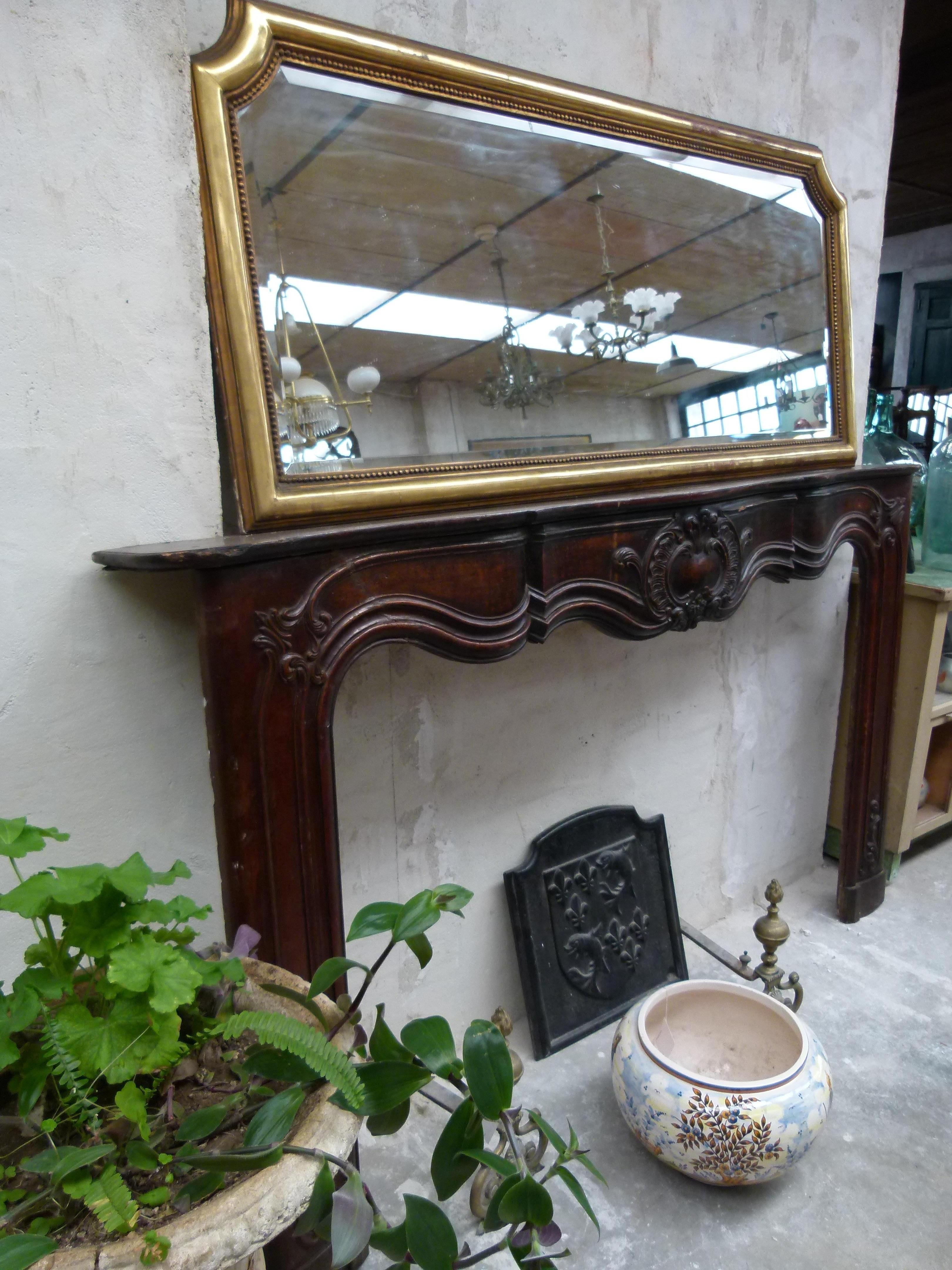 18th Century hand carved wooden fireplace mantel that will bring a cozy ambiance to your sitting room.

 