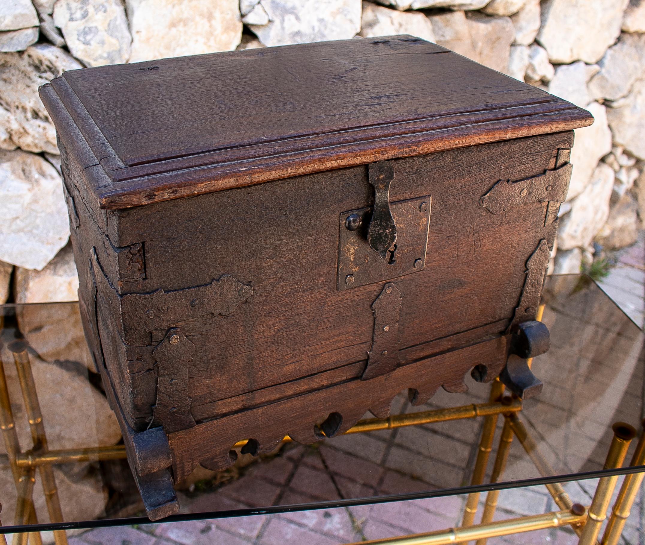 Antique 18th century Spanish wooden trunk with iron hardware.