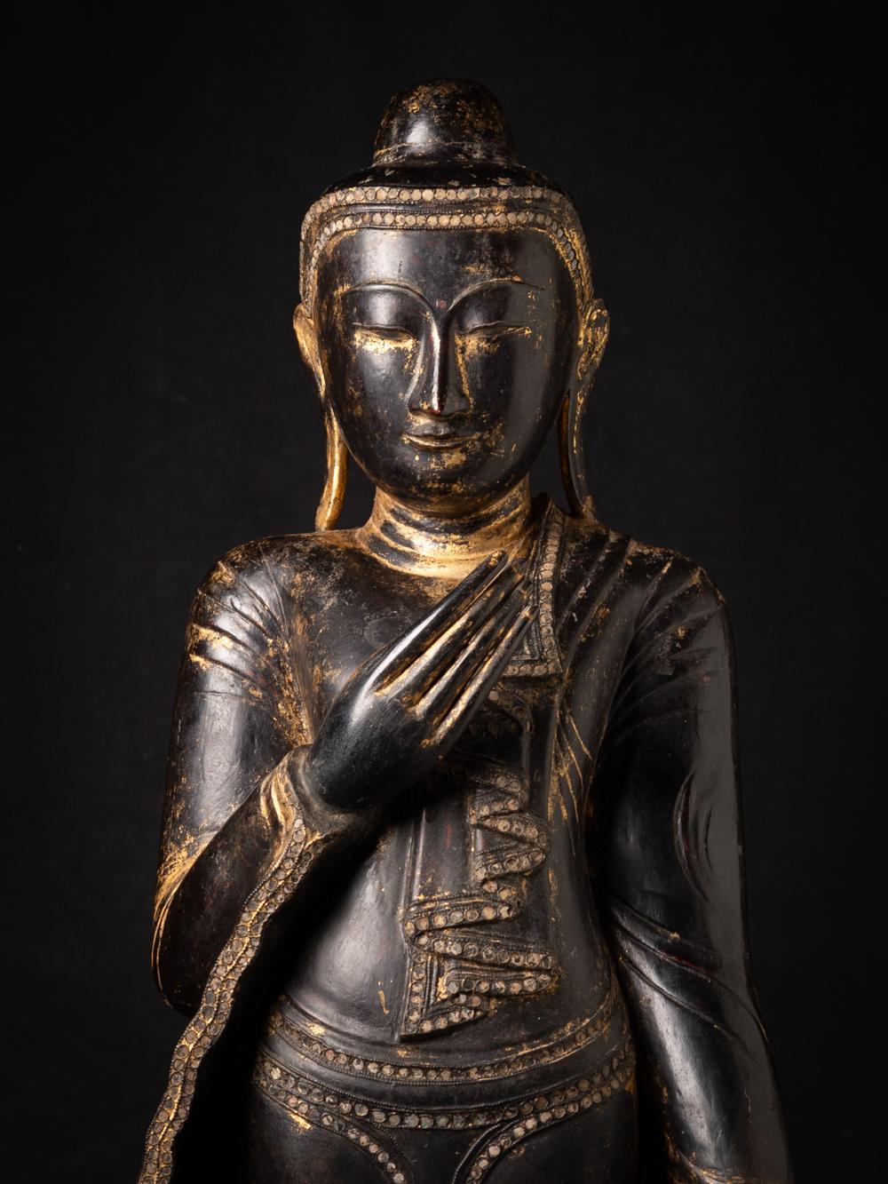 This Special antique wooden Burmese Buddha statue is a truly unique and special collectible piece. Standing at 114,5 cm high, 40,5 cm wide and 24 cm deep, it is made of wood and it weighs 16,05 kgs. The intricate details on the statue are with
