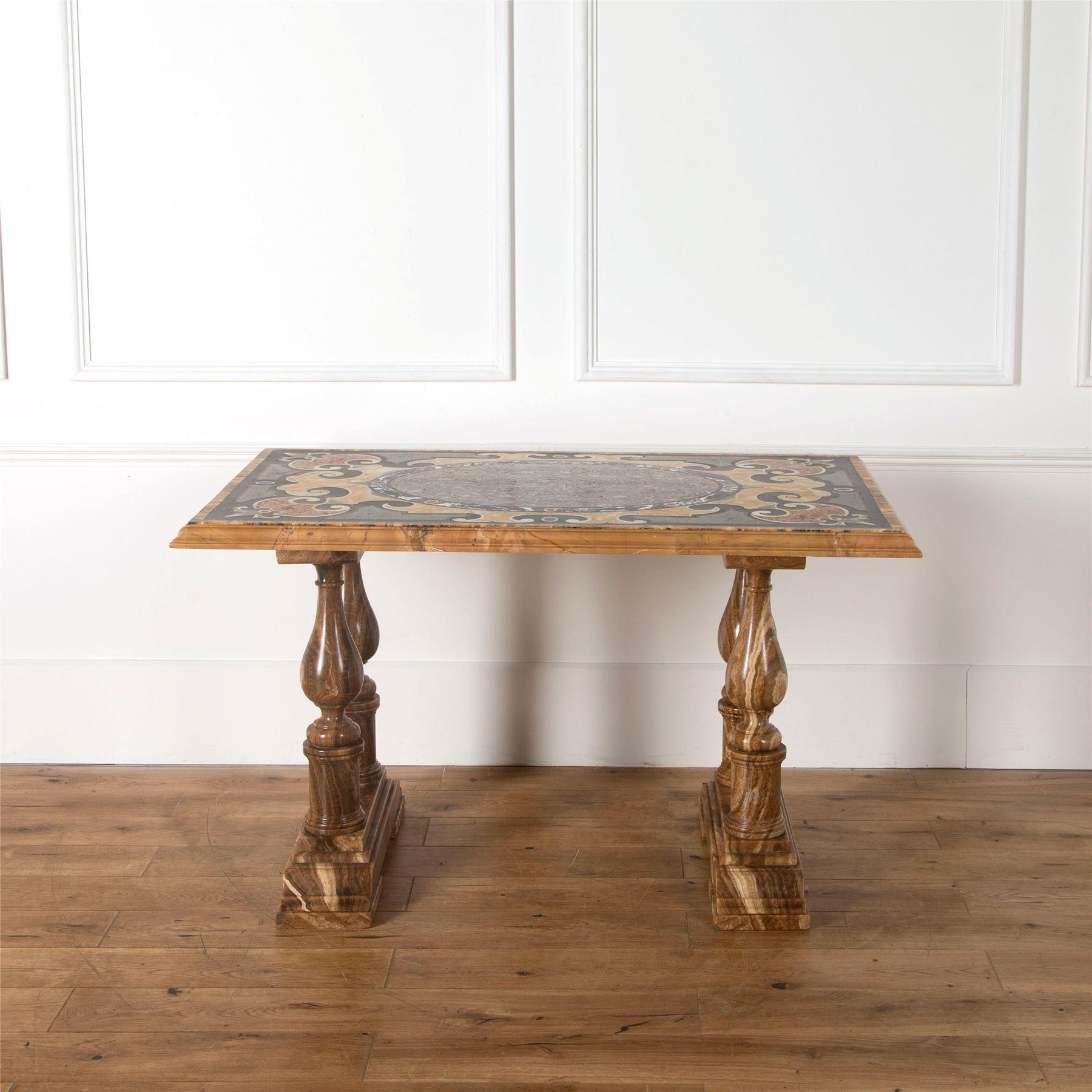 A fantastic 18th century Italian marble centre table. The beautifully inlaid top has a central oval plaque of extremely rare Luna Chiella marble (not being quarried for over a thousand years), with Rosso Antico edging and banded with Grande Antique,