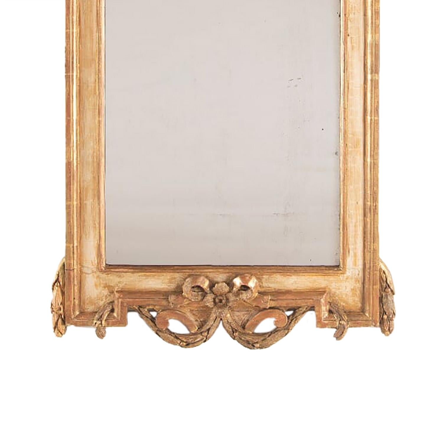 18th century Stockholm work Swedish mirror washed to its original gilding. This piece is a good size, and manufactured in 1780.