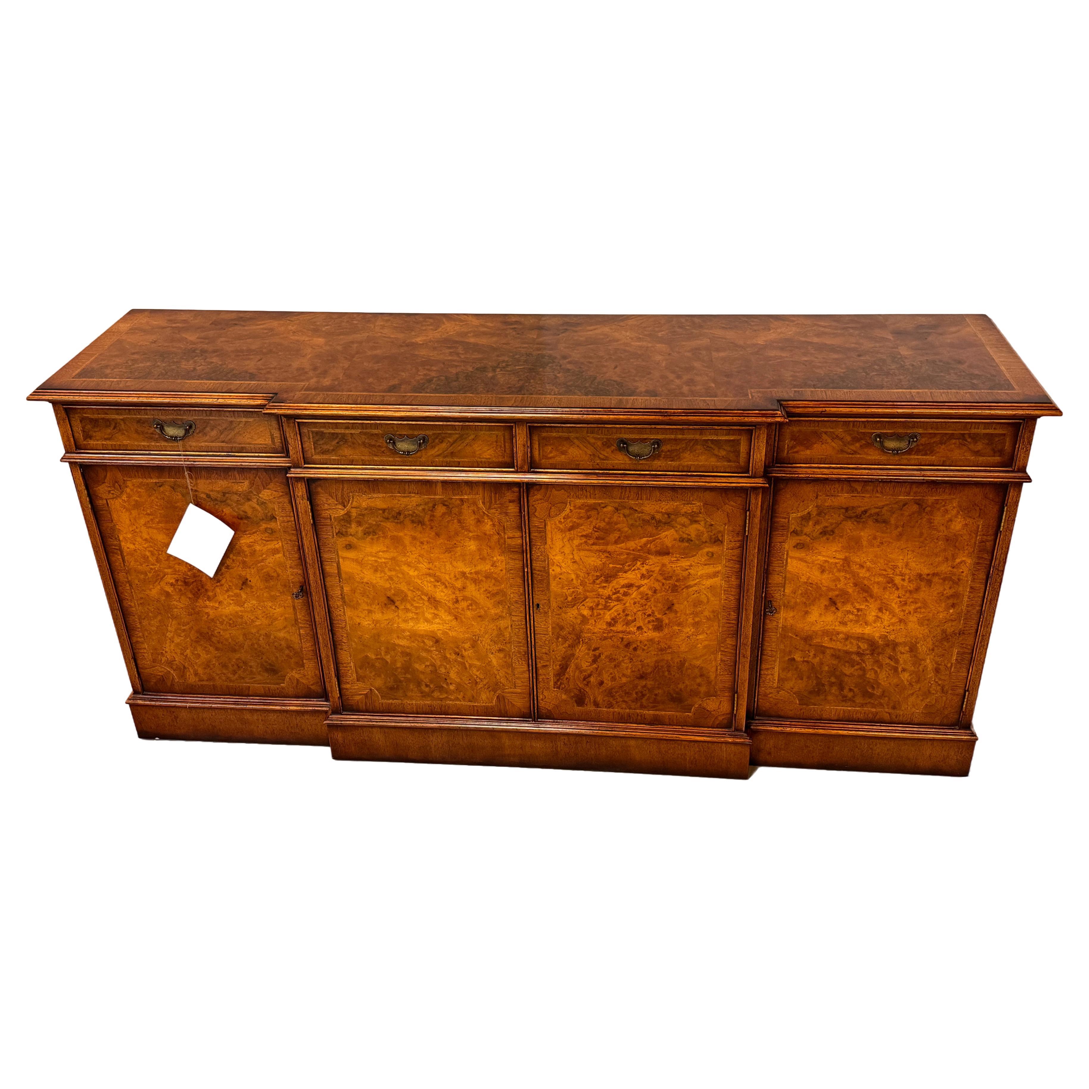 This stunning 18th Century Style Buffet Sideboard in Walnut Burr which is a prized wood known for its beautifully richly grained pattern is a magnificent piece of furniture.  Not only is it gorgeous, but it is also practical with ample space for