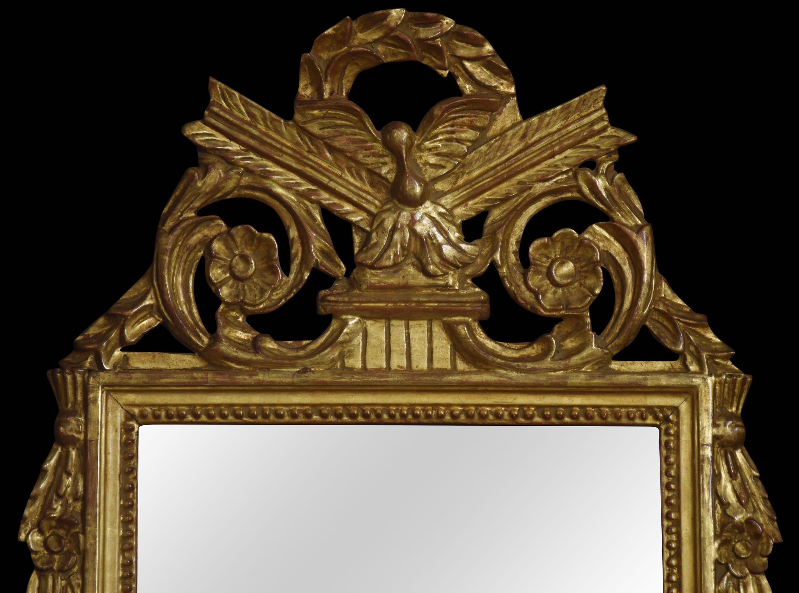 18th century style gilt framed wall mirror, the original mirror plate encased in a gilt frame with a classical laurel wreath, and floral cresting.
Dimensions
Height 38 inches
Width 22.5 inches
Depth 1.5 inches.