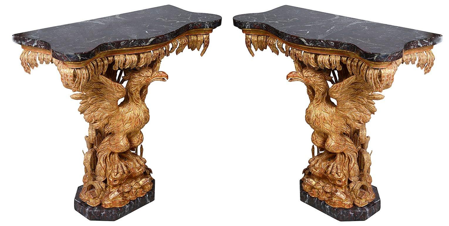A very impressive pair of 18th Century style carved gilt wood Eagle console tables, in the manner of William Kent.
Each table having their original serpentine Breccia marble top, hanging leaf decoration to the frieze,
the eagles standing in opposing