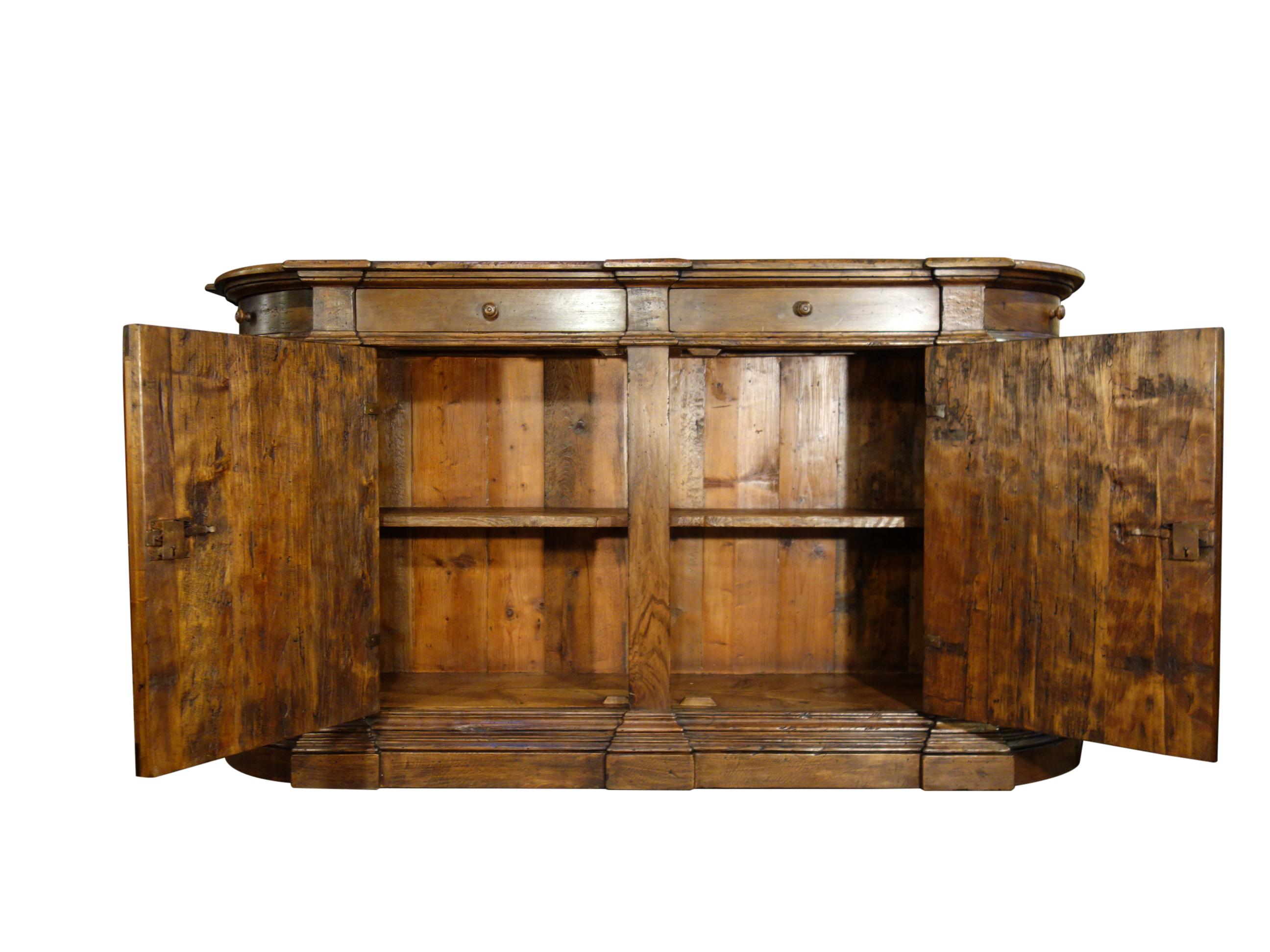 Italian Old Walnut Credenza with Olivewood Burl:  18th Century Style

Extraordinary Italian handcraft as exhibited in this finely mastered Italian four-door and four-drawer credenza sideboard, featuring thick aged Italian solid walnut planks, panels