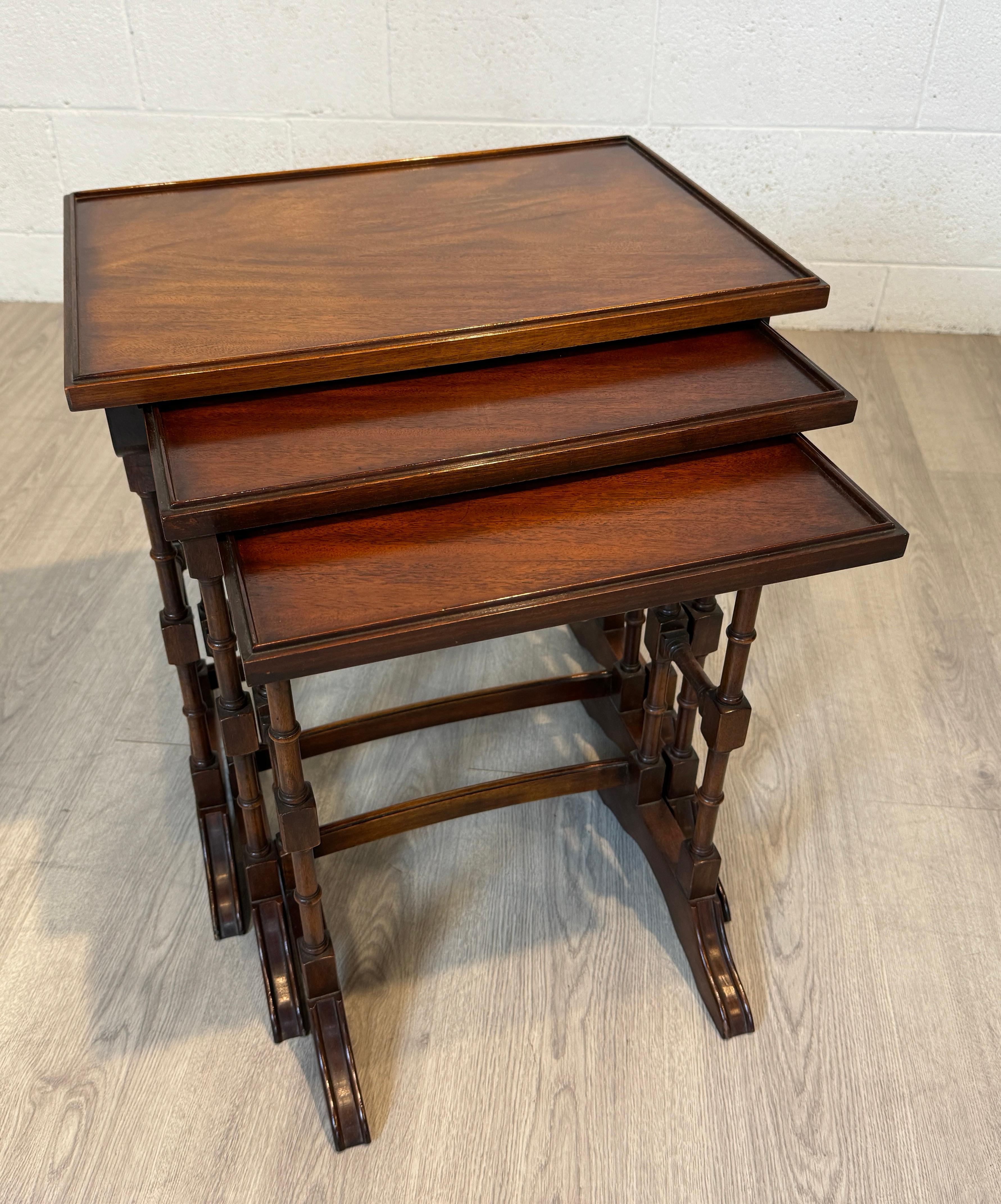 Who wouldn't want such a lovely set of 18th Century Style Regency Nesting Tables?  Crafted in Mahogany in England in the last century.  Not so old that they are too delicate for living, but having had  enough history to develop that rich patina