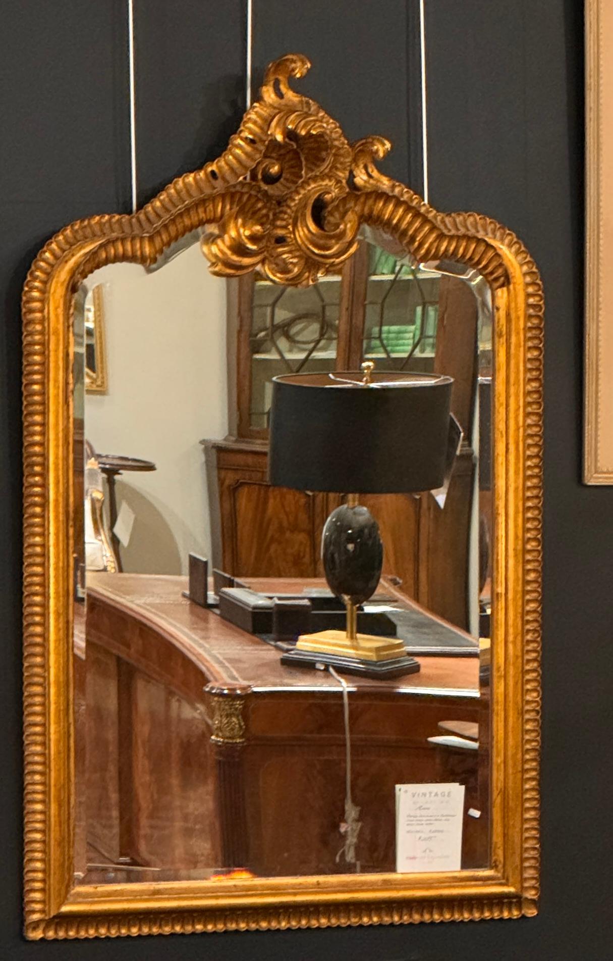 18th Century Style Rococo Gold Mirror with Bevel Glass and deep gold finish.  Good proportions 
Elevate your home with this exquisite Gold 18th Century style mirror, designed in the iconic Chippendale Rococo fashion. Crafted with meticulous