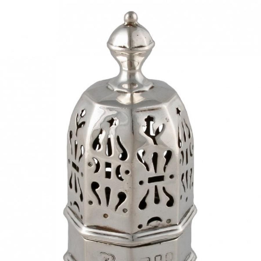 An 18th century style silver octagonal shaped sugar caster.

The caster is made in the 20th century and is marked underneath 