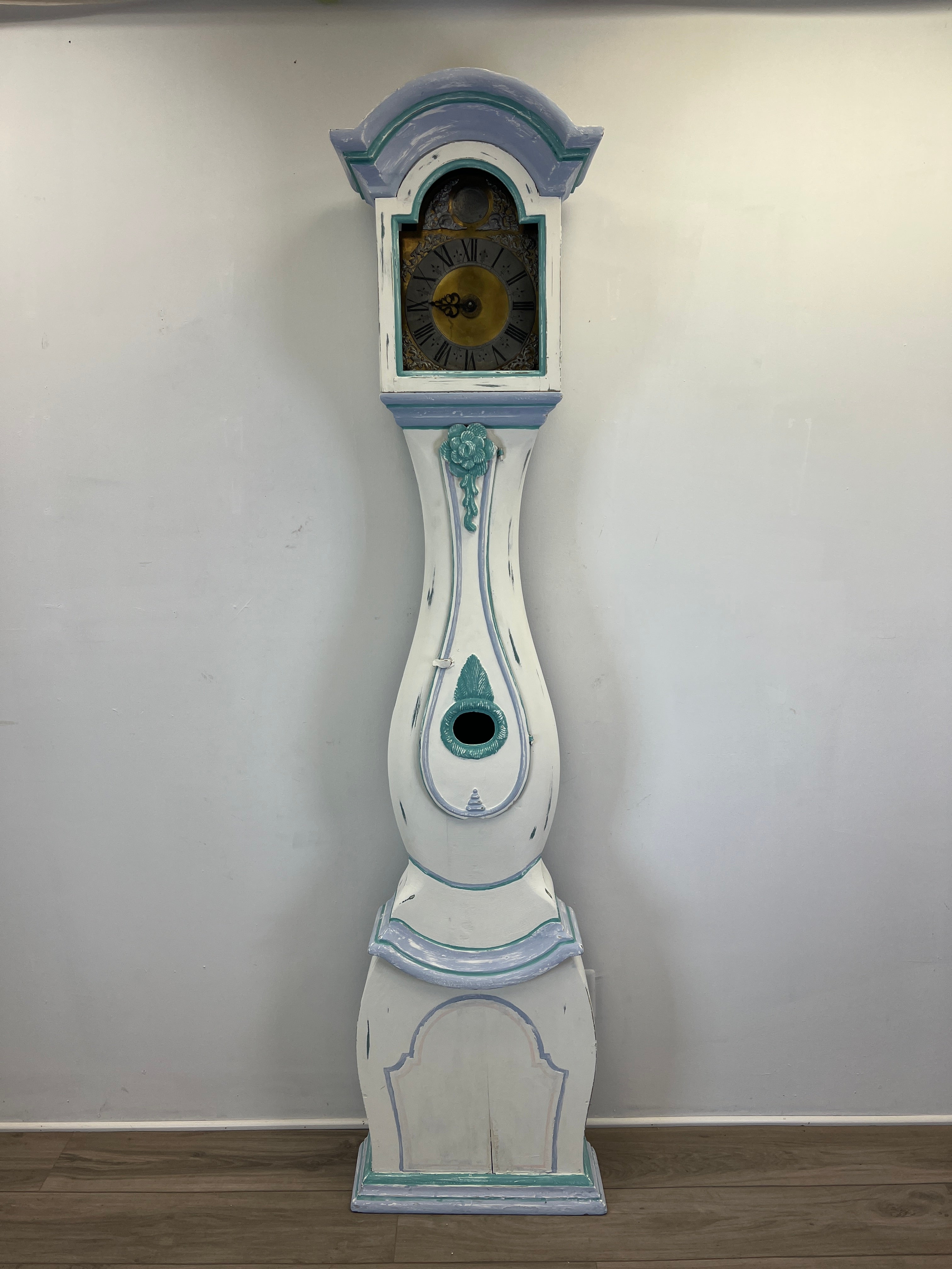 White re-painted baroque long case clock from the early 18th Century. This clock was originally blue but we've repainted it in white and Louis Blue. The clock is Swedish and made from Swedish pine with the design and clock face from the 18th