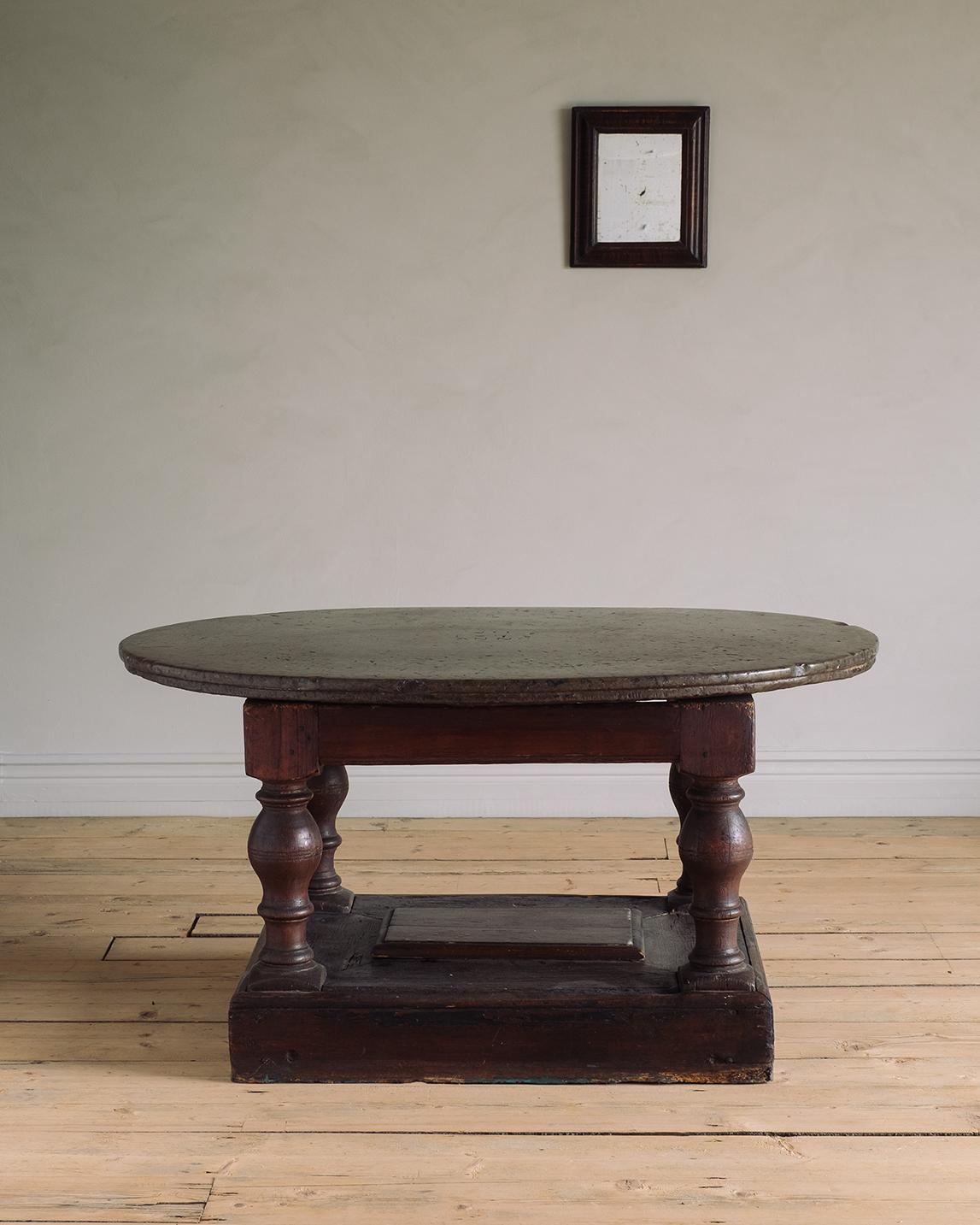 Early 18th century Swedish baroque centre table with an oval limestone top dated 1718 from the island of Öland. 

Good condition with wear consistent with age and use. Original finish with light scratches on the limestone top. A detailed condition