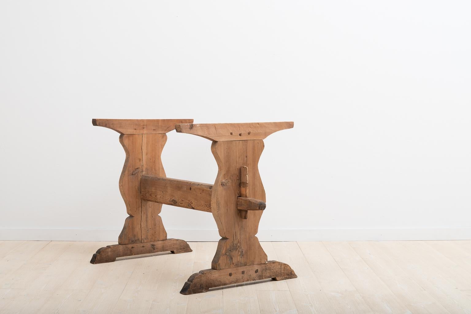 Trestle table with profiled legs in pine. The table has smaller marks and traces after over 250 years of use see picture. All pieces are original to the table including the wedges. Manufactured in northern Sweden, circa late 1700s.