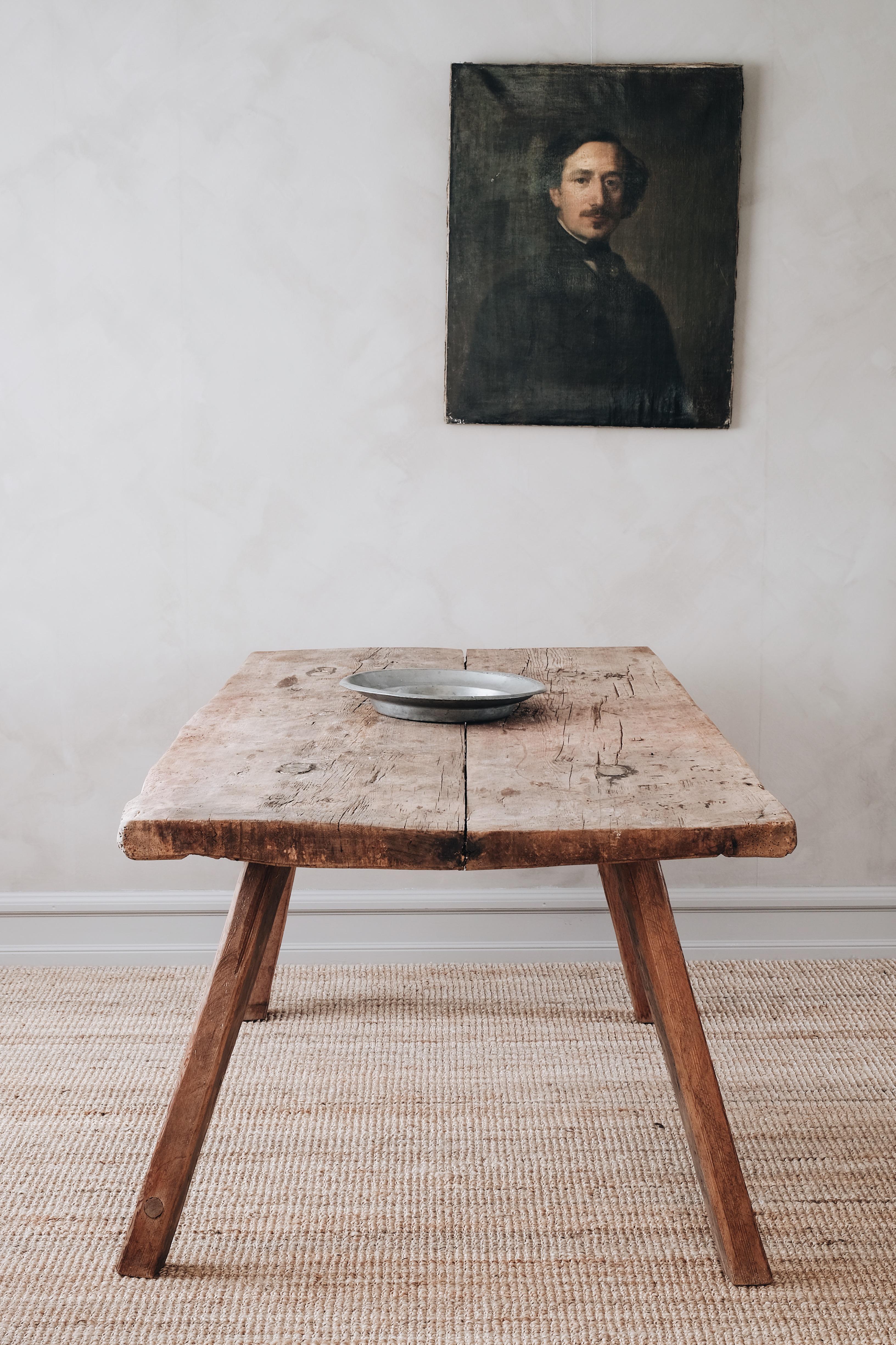 Primitive Swedish late 18th century farmhouse dining table with a thick twin plank top that has aged very well, Sweden, circa 1790. 

These table's where made from early 17th-late 19th century and was most likely used as a multi-purpose piece.