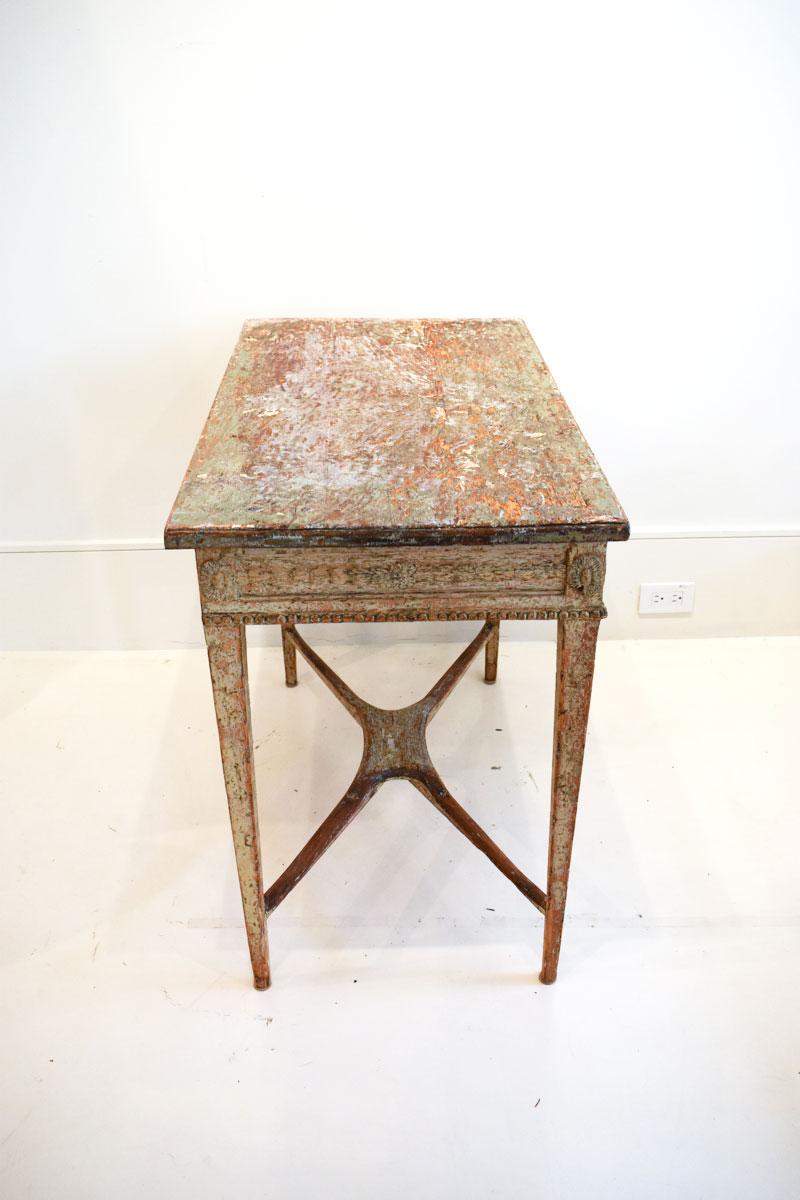The 18th century Swedish Gustavian console table is a classic piece of furniture known for its elegance, simplicity, and refined details. The Gustavian style, named after King Gustav III of Sweden, combines French Neoclassical elements with Swedish