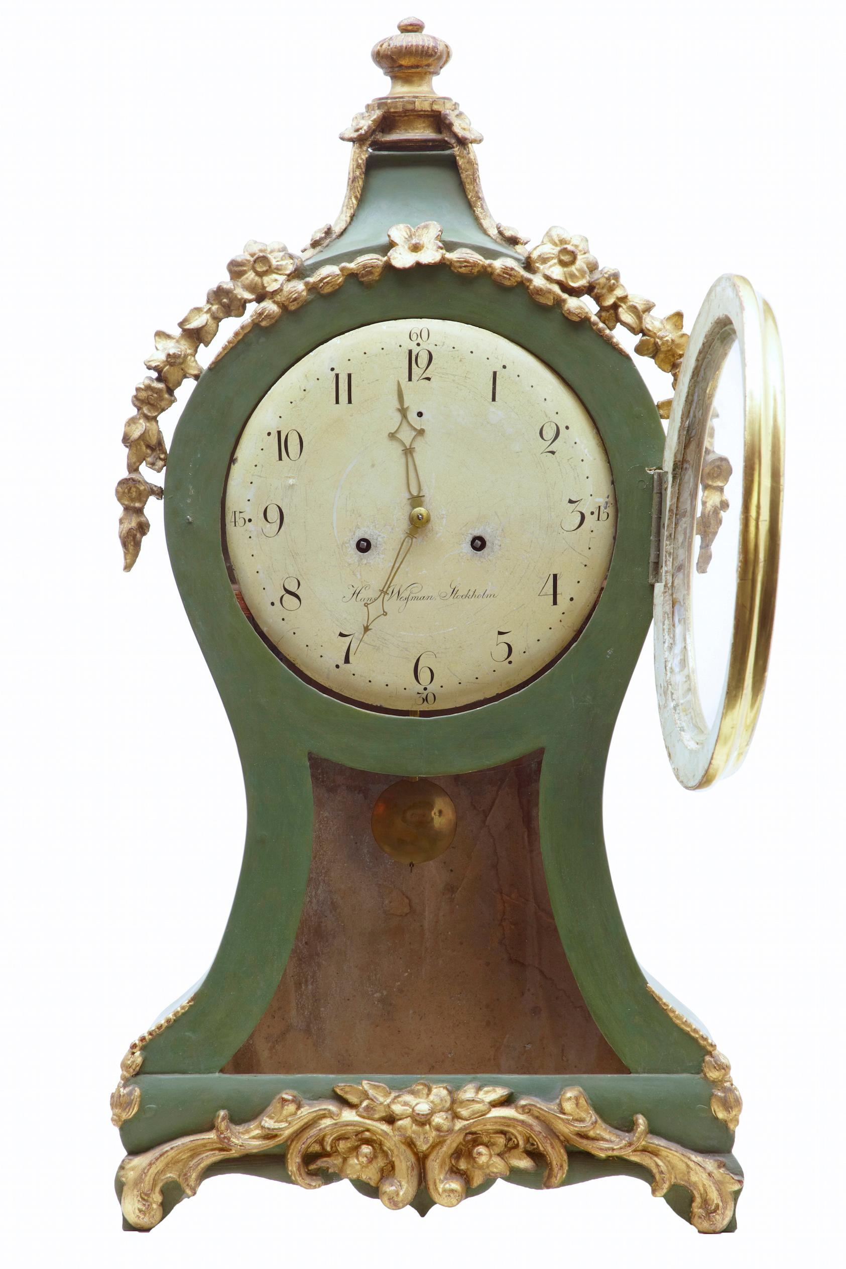 18th century Swedish gilt and painted mantle clock, circa 1790.

Fine quality Swedish clock in original condition. Original green paint with gilt carved wood decoration, a real fine quality piece. Clock face signed Hans Westman, Stockholm.
Clock