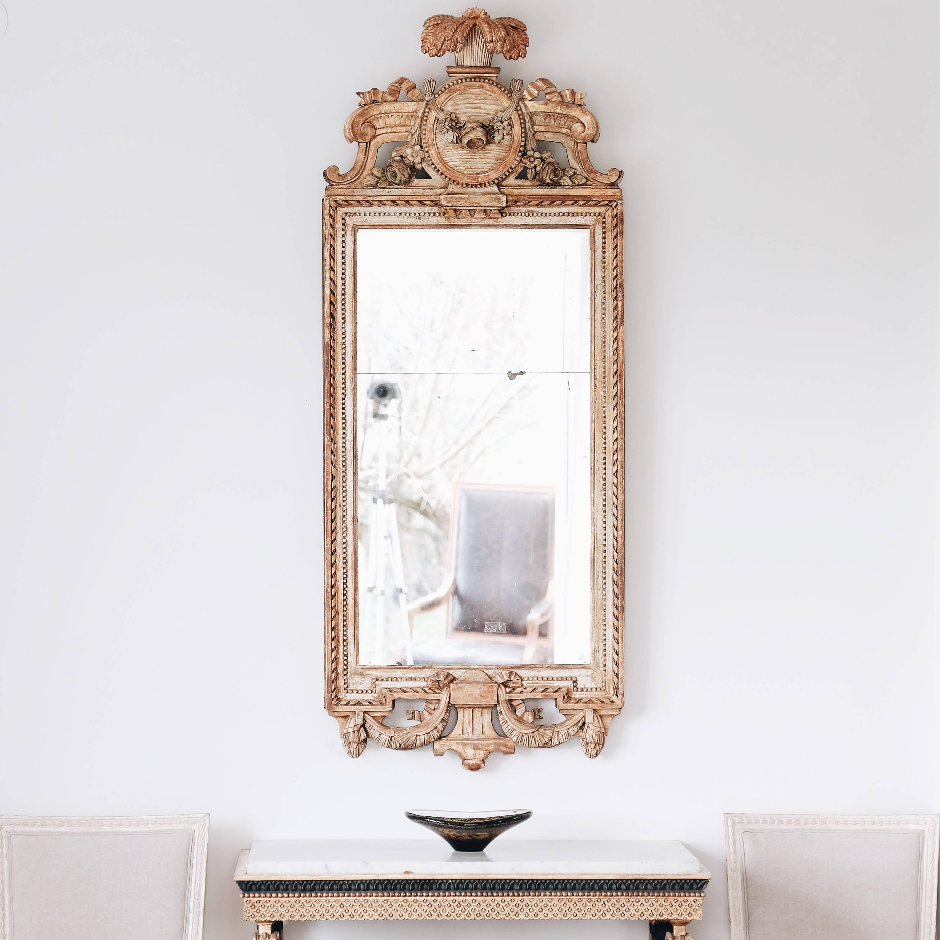 Unusually large and impressive 18th century Swedish Gustavian giltwood mirror. Signed by master mirror maker Johan åkerblad (1728-1799). With original mirror glass and gilt showing great patina, circa 1790.

Good condition with wear consistent